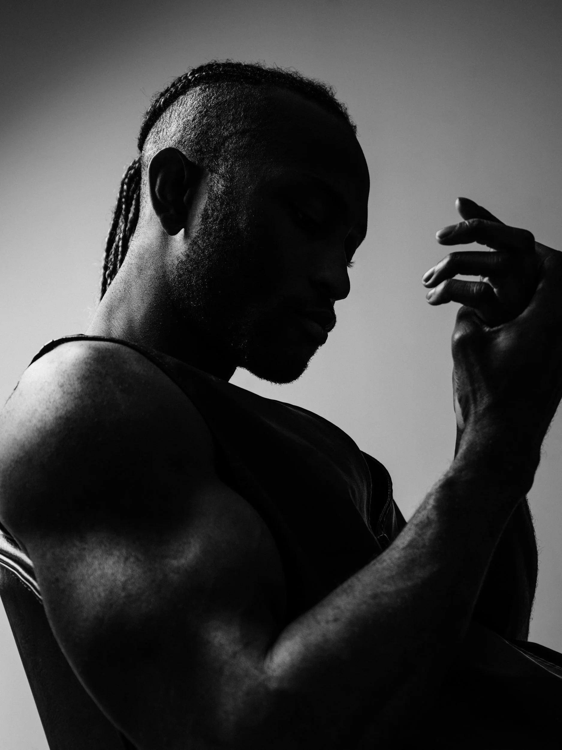 Silhouette of Paul Bossman's arm and shoulder, black and white training portrait