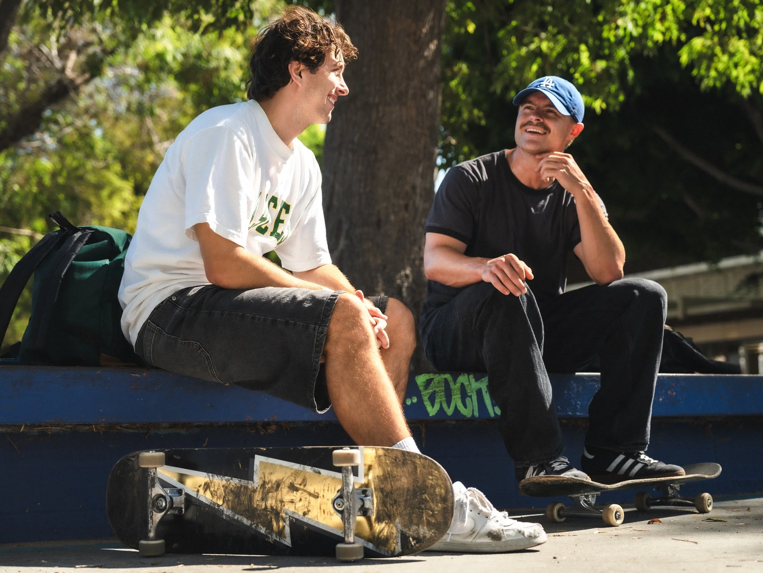Brandon Loufas and Isaiah Rojers talking between runs at the West LA Courthouse skatepark, Los Angeles skate photography by Osy Ikhile