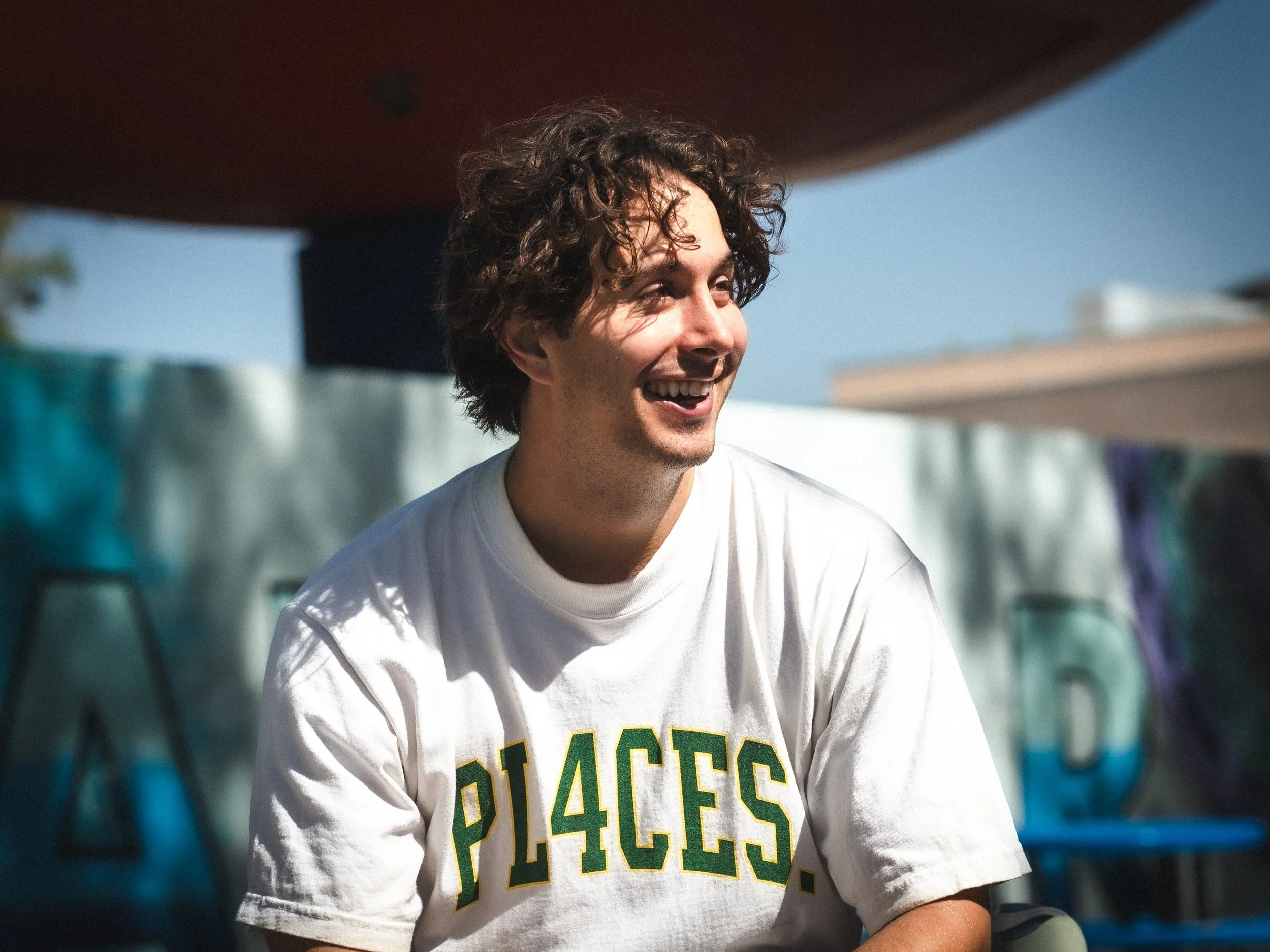 Brandon Loufas laughing between runs at the West LA Courthouse skatepark, Los Angeles skate photography by Osy Ikhile