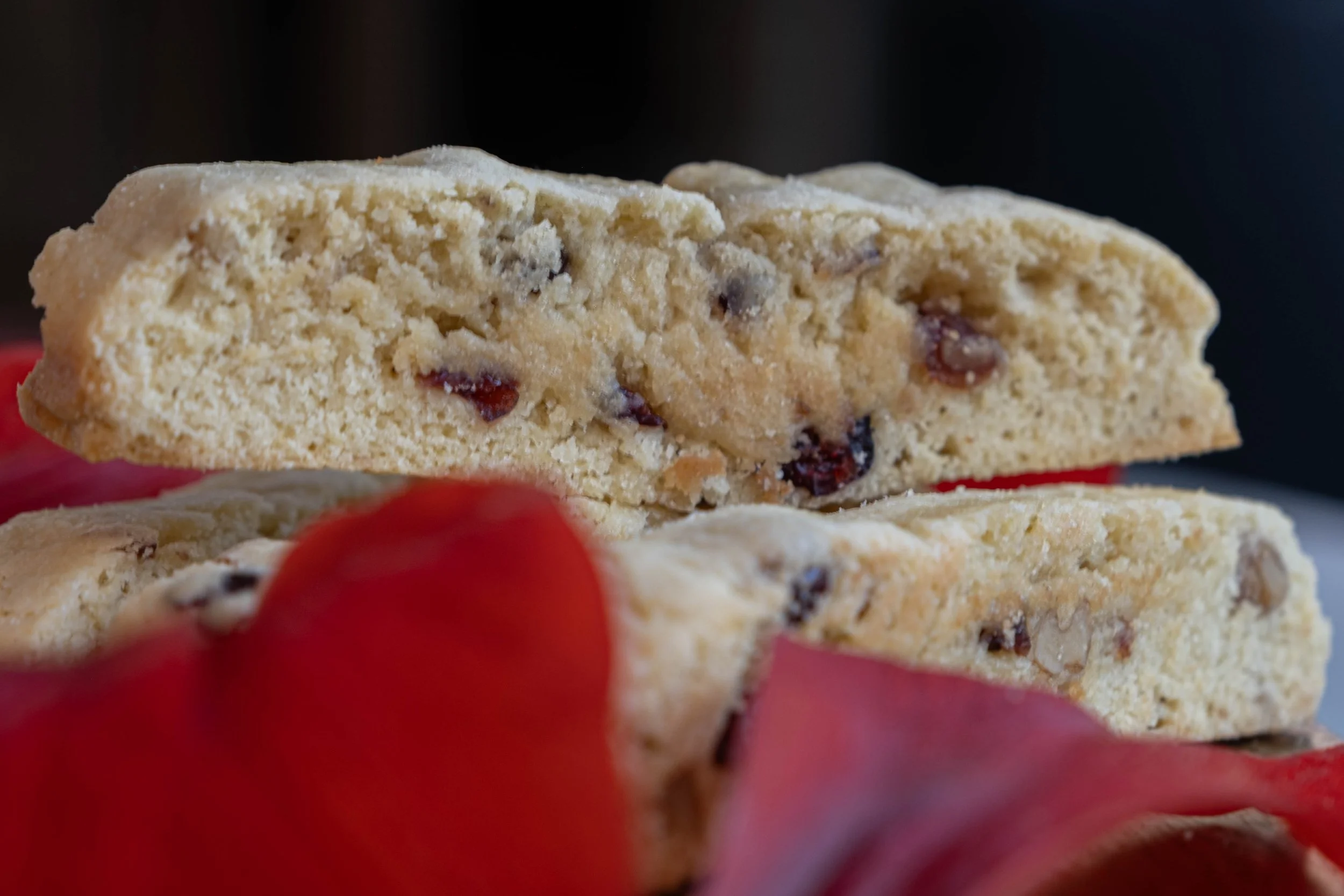 Close-up of two handmade Italian orange and walnut biscottis.