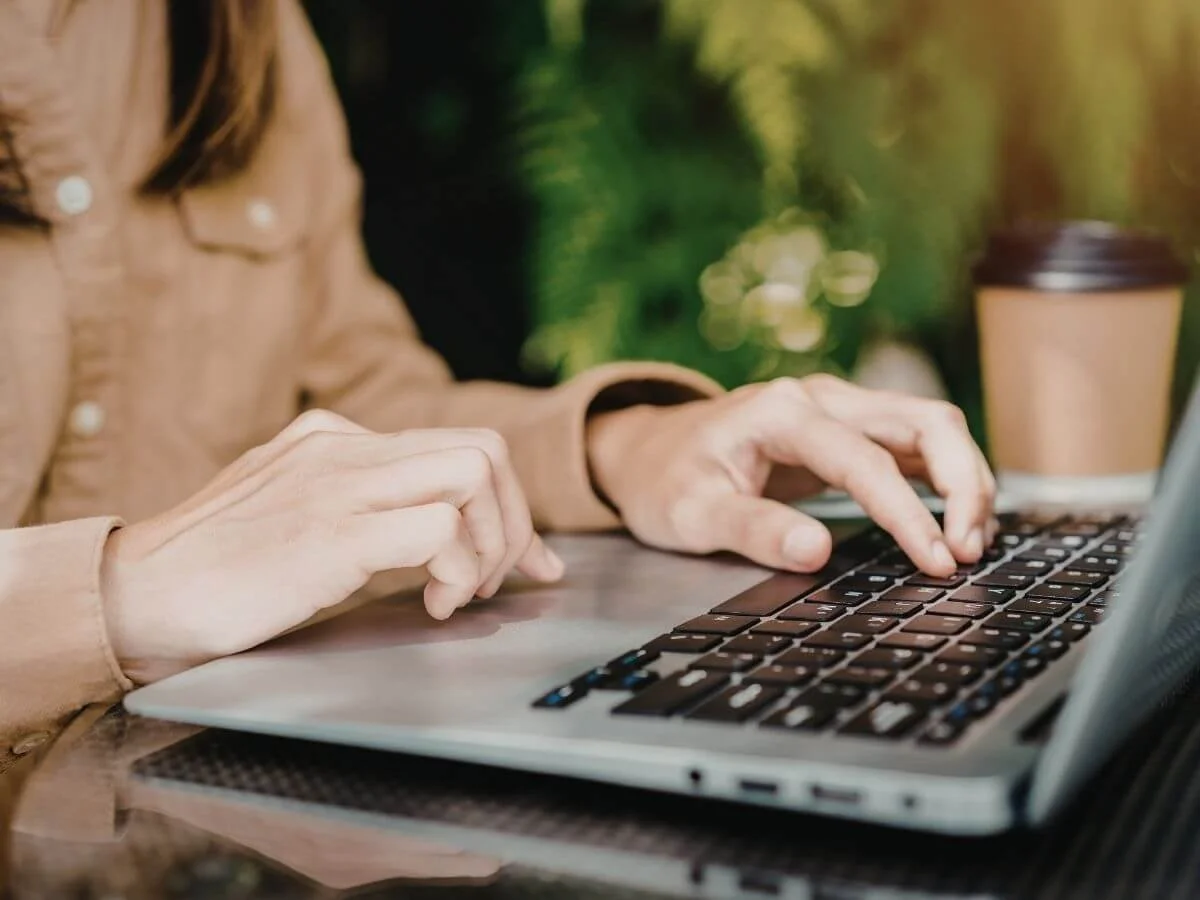 Person researching bipolar information on a laptop.