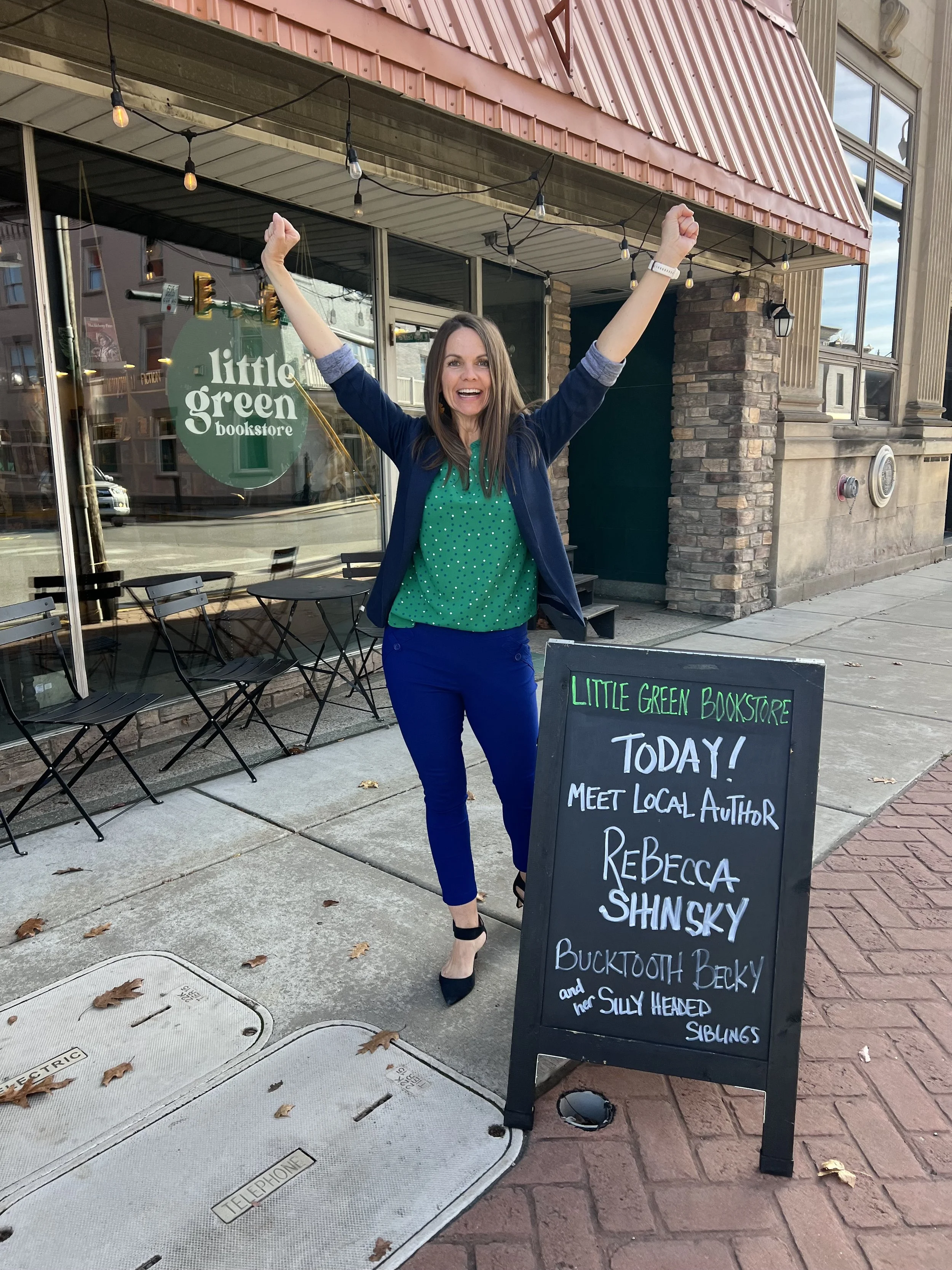 Rebecca doing a local books shop visit while engaging with young readers