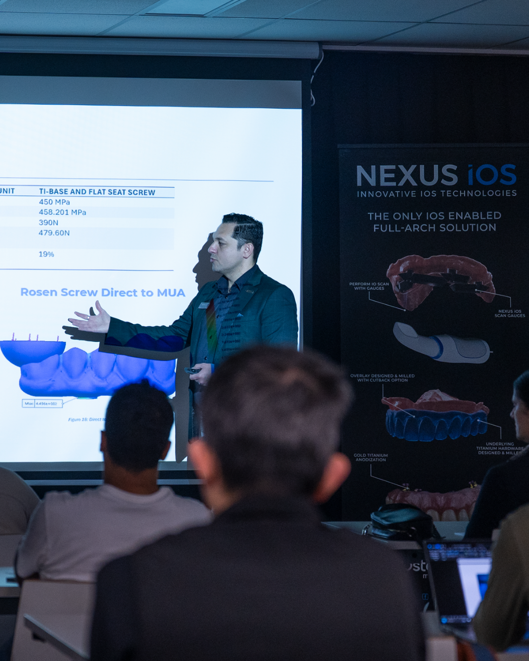 Dentist reviewing Digital Smile Design software during ARIA's All-on-X course in Melbourne