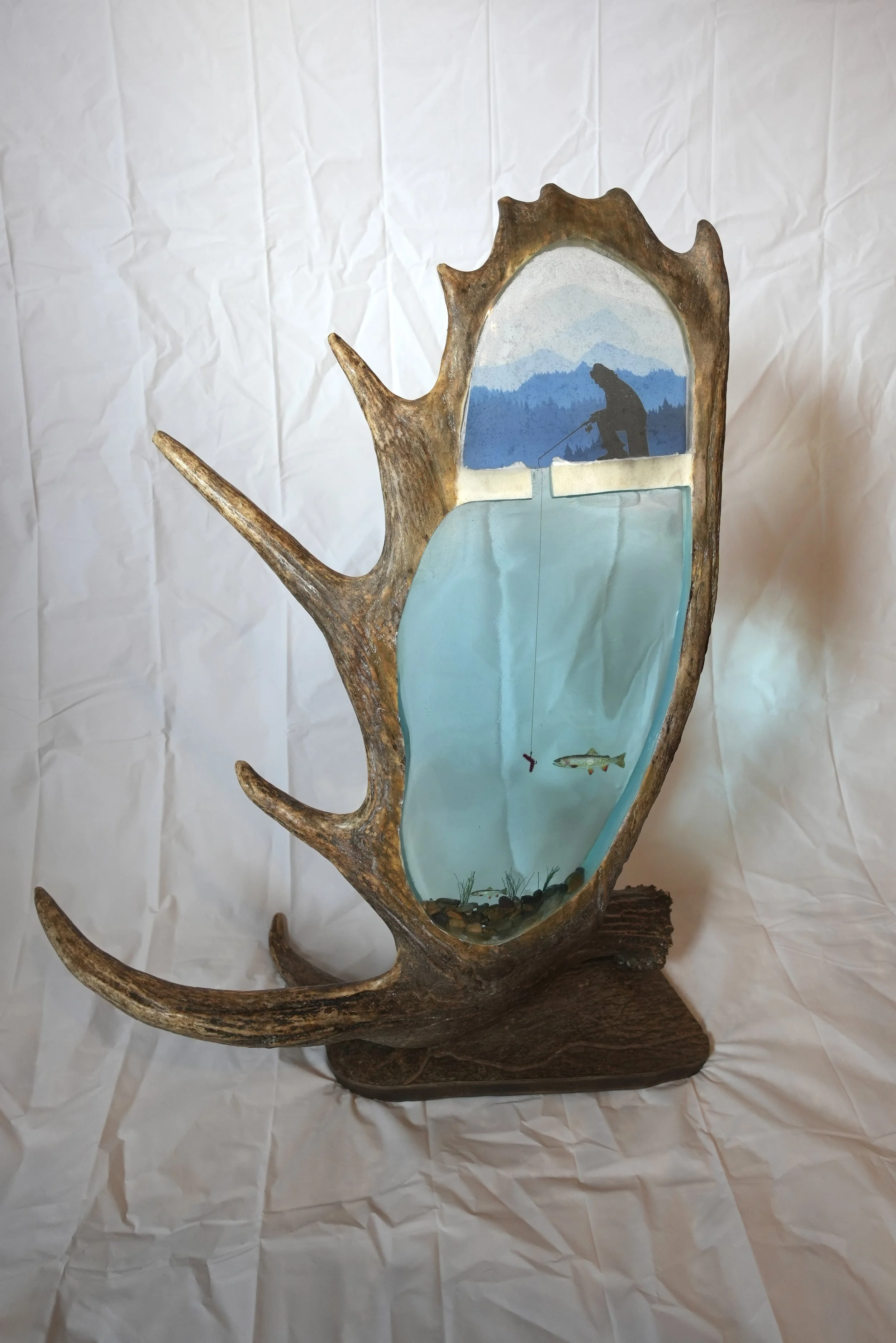 Ice fisherman and trout