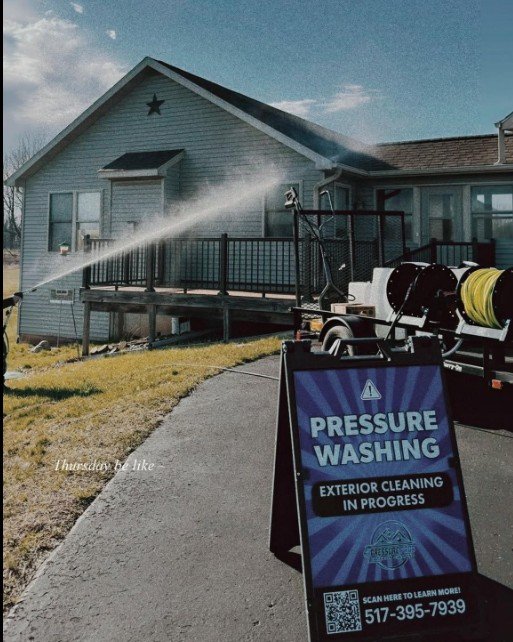 Spraying house with sign.jpg