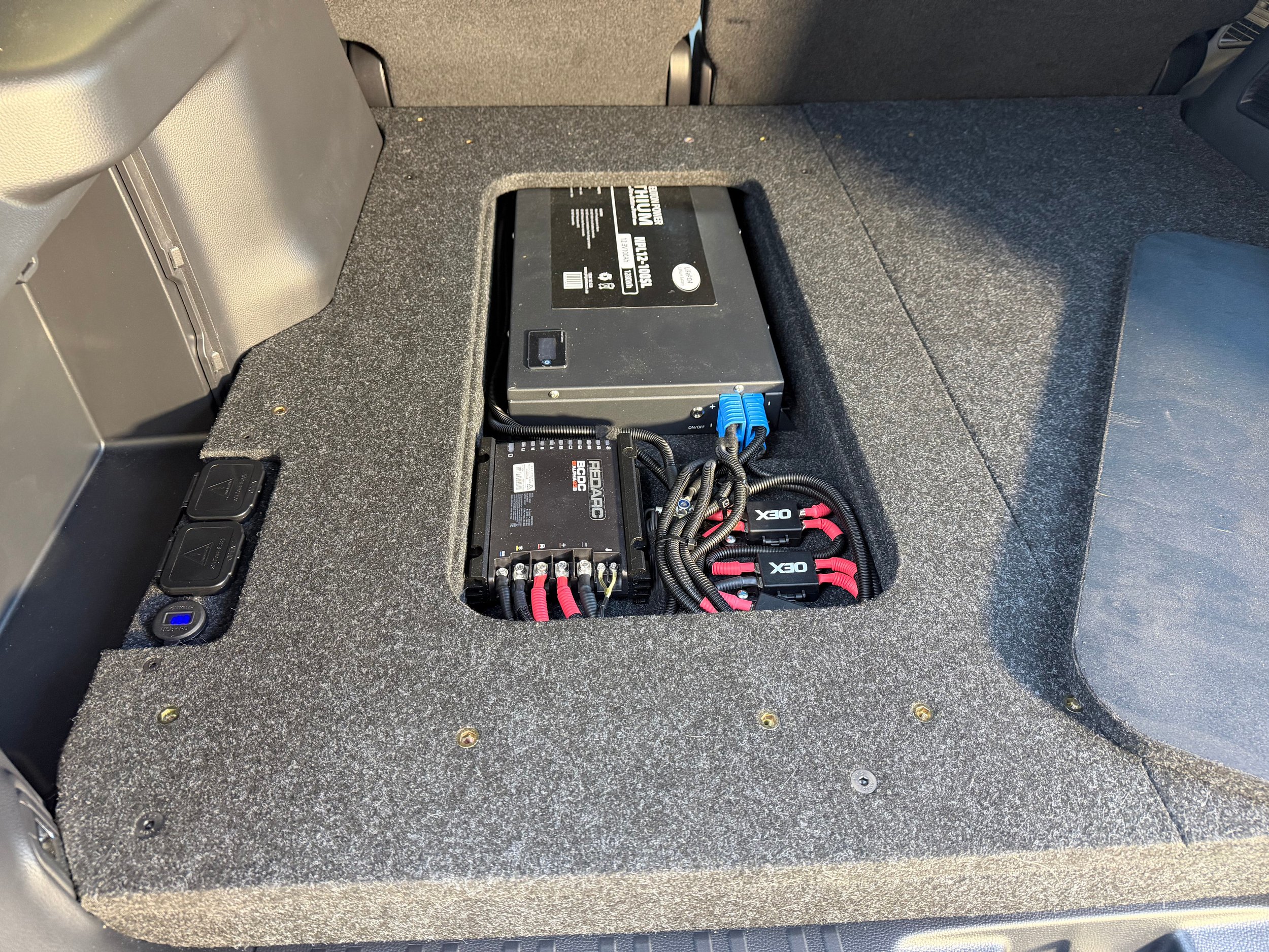 Prado 250 PowerDeck lithium dual battery false floor with flush Anderson outlet USB ports solar input and Redarc charger under service hatch Lawson Automotive