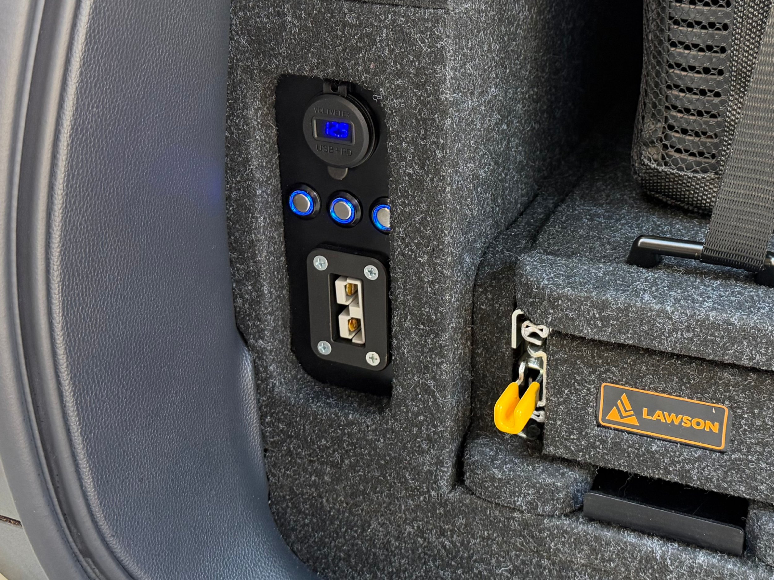 Prado 250 powered side wing close-up with Anderson outlet USB ports battery gauge and illuminated switches on Lawson Automotive INFINITY false floor system