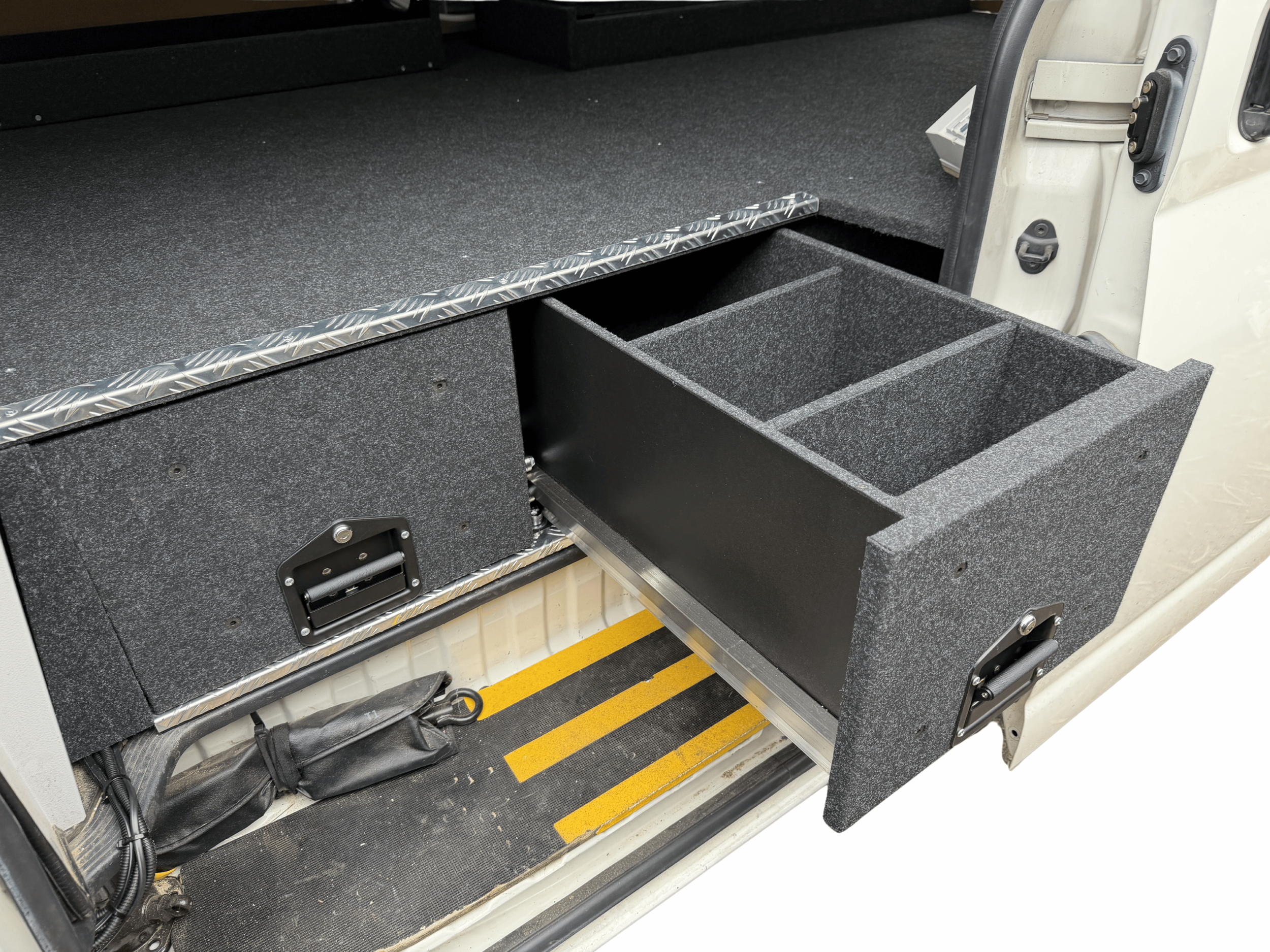 HiAce side door access showing front drawers fridge and organised storage layout