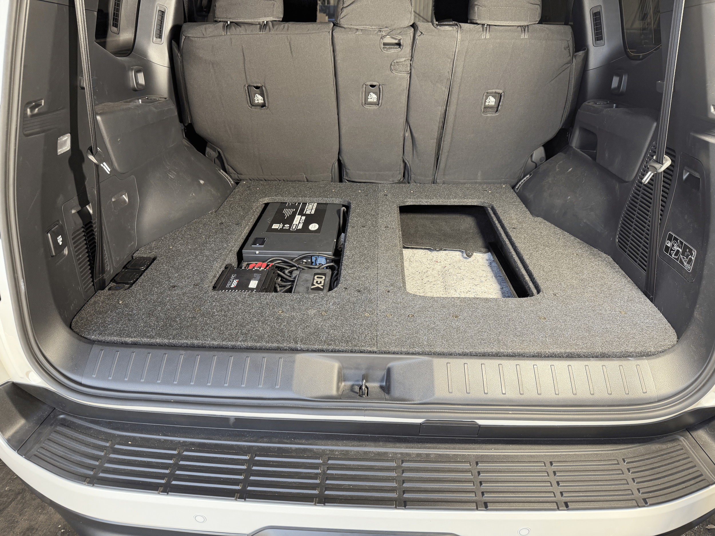 Landcruiser 300 series dual battery false floor system.png