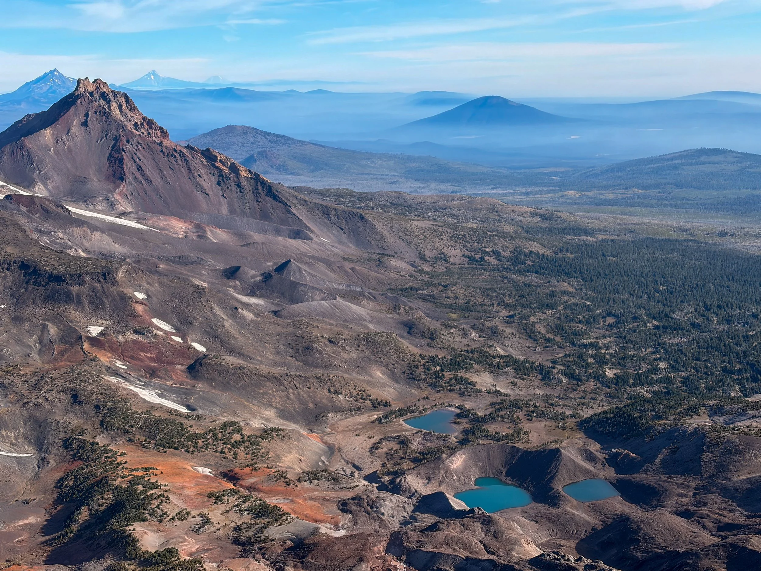 View of North Sister, with several other Central Oregon Cascades peaks in the background, and three blue glacial lakes in the foreground