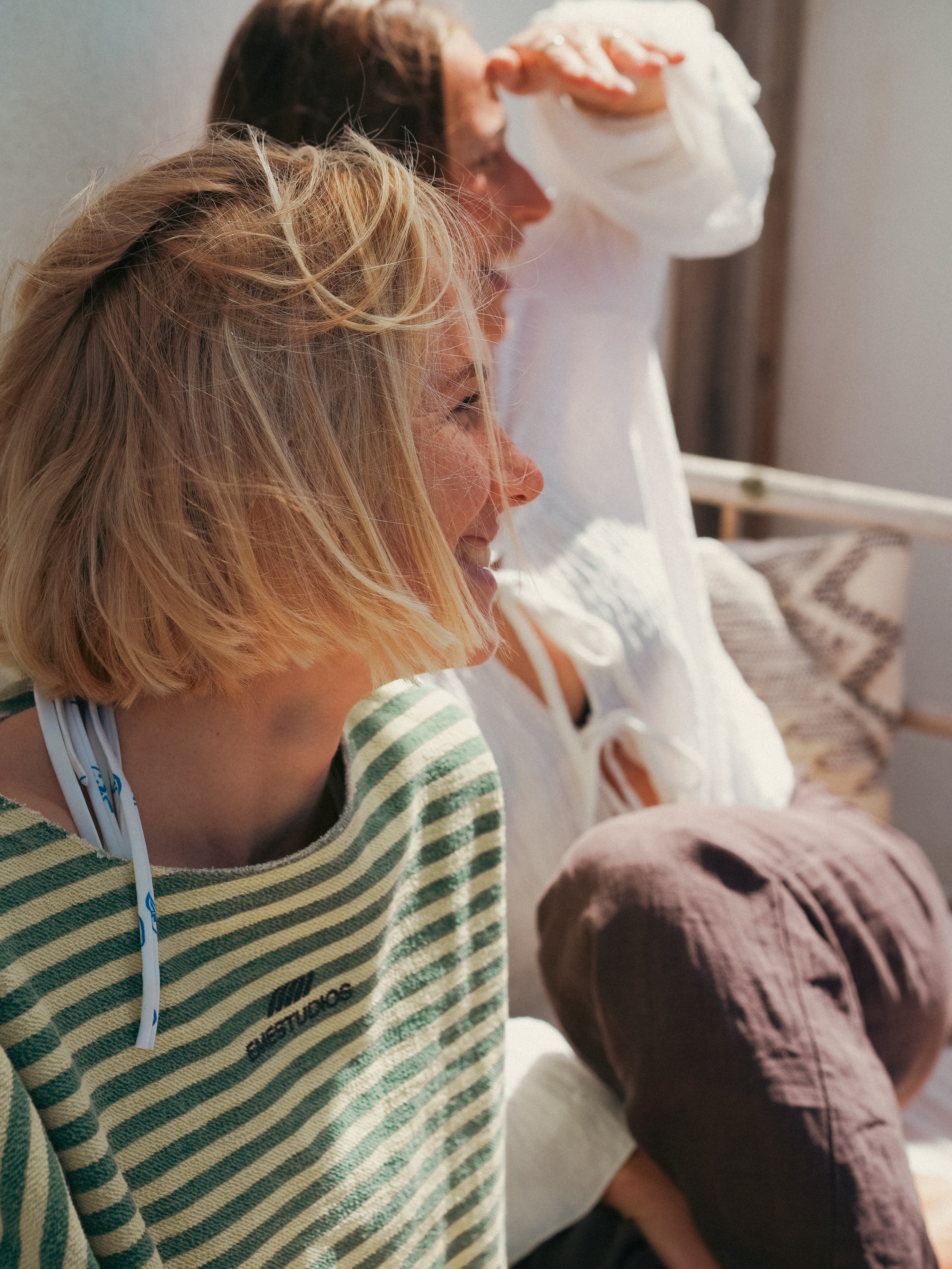 Group of women relaxing together at a surf and yoga retreat in Portugal