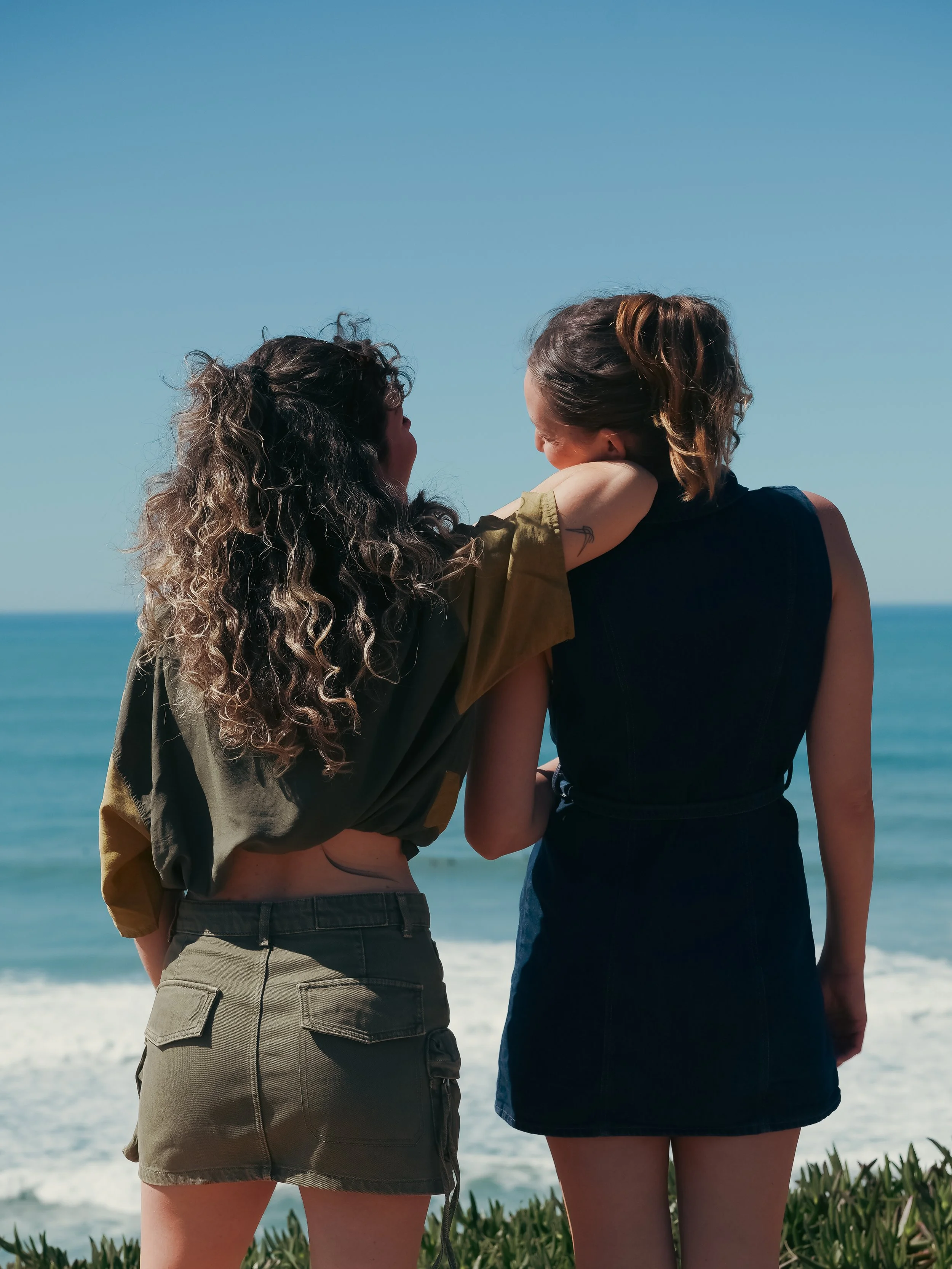 Shared moments between women at retreat near the ocean