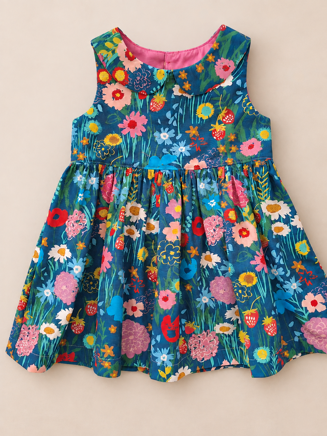 Handmade girls floral dress in blue cotton with colourful flowers and strawberries