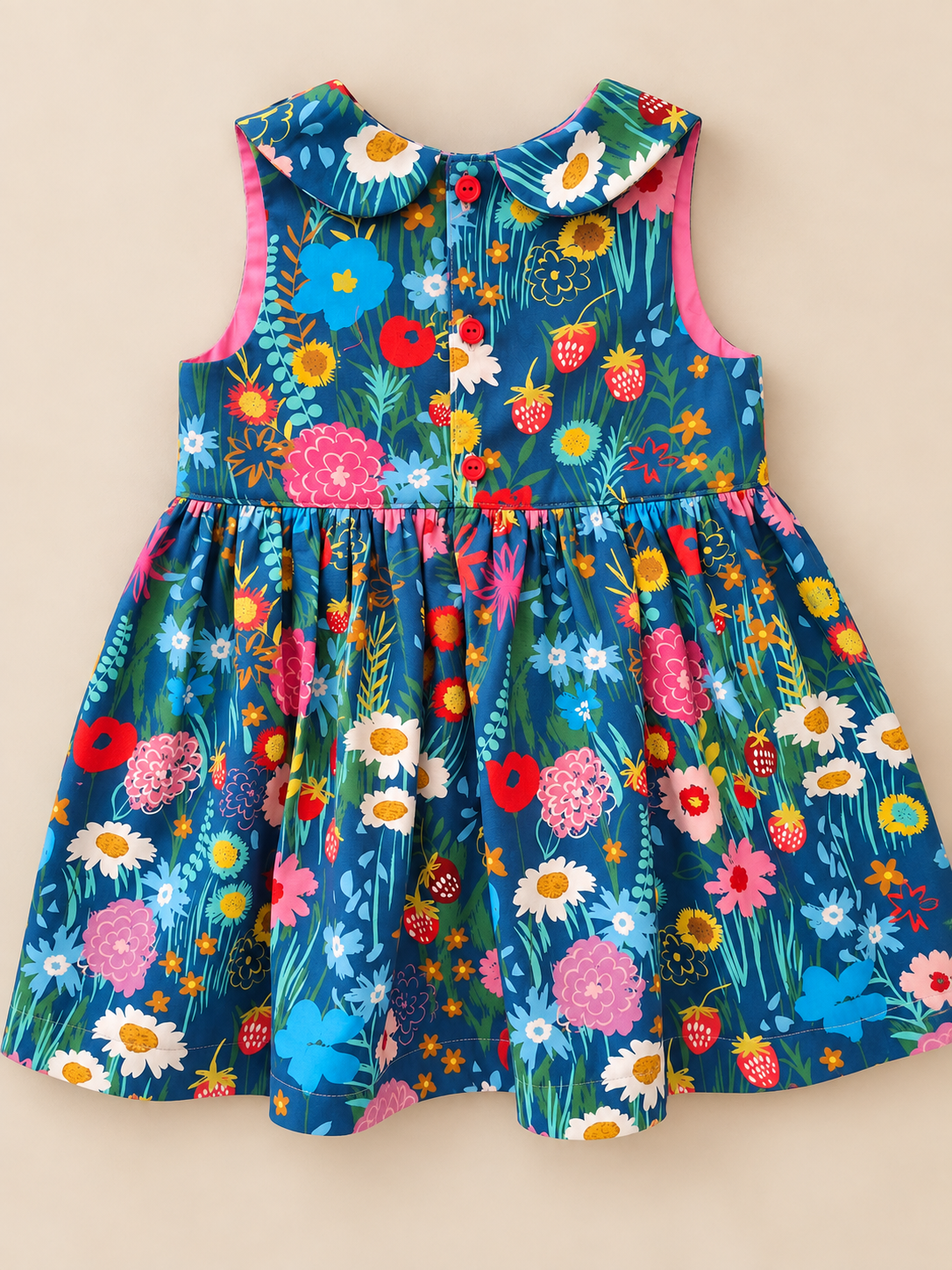 Handmade girls floral dress in blue cotton with colourful flowers and strawberries back