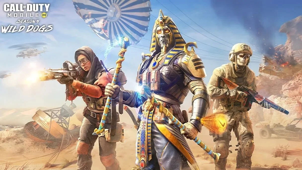 Characters from Call of Duty Mobile Season 4 Wild Dogs event, featuring a Pharaoh-themed character in the middle wielding a staff, with two soldiers on either side holding guns in a desert battlefield scene.