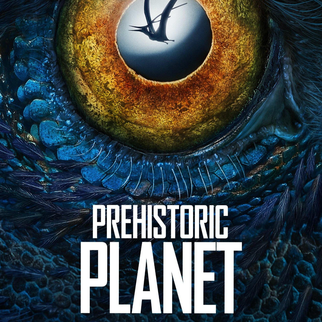 Close-up of an eye with a greenish-brown iris and blue and black feathers around it. Inside the pupil, there is an image of a prehistoric bird flying against a cloudy sky. The text at the top reads: "Apple TV+ A Five-Night Documentary Event." The tex