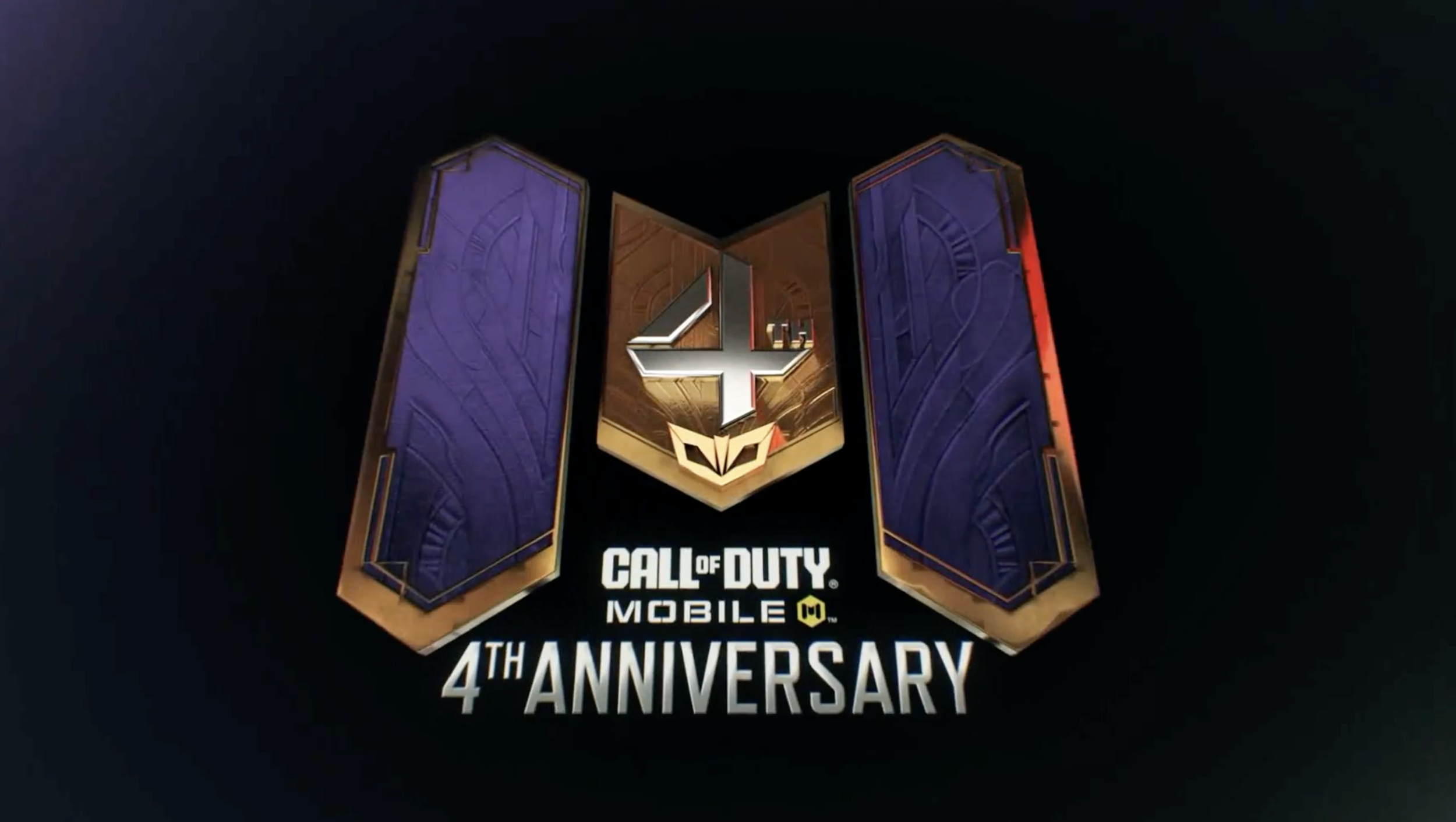 Call of Duty Mobile 4th Anniversary logo featuring a shield with a star and a mask, flanked by two tall purple panels with gold border designs.