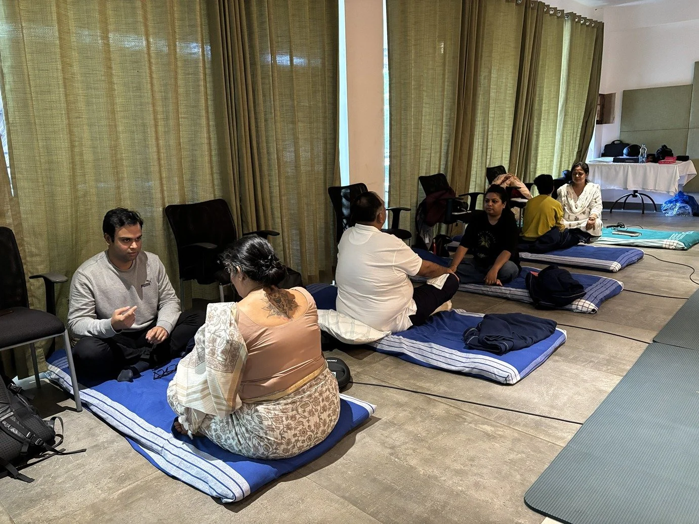 Group of students using in Monre Institute training practicing with each other.