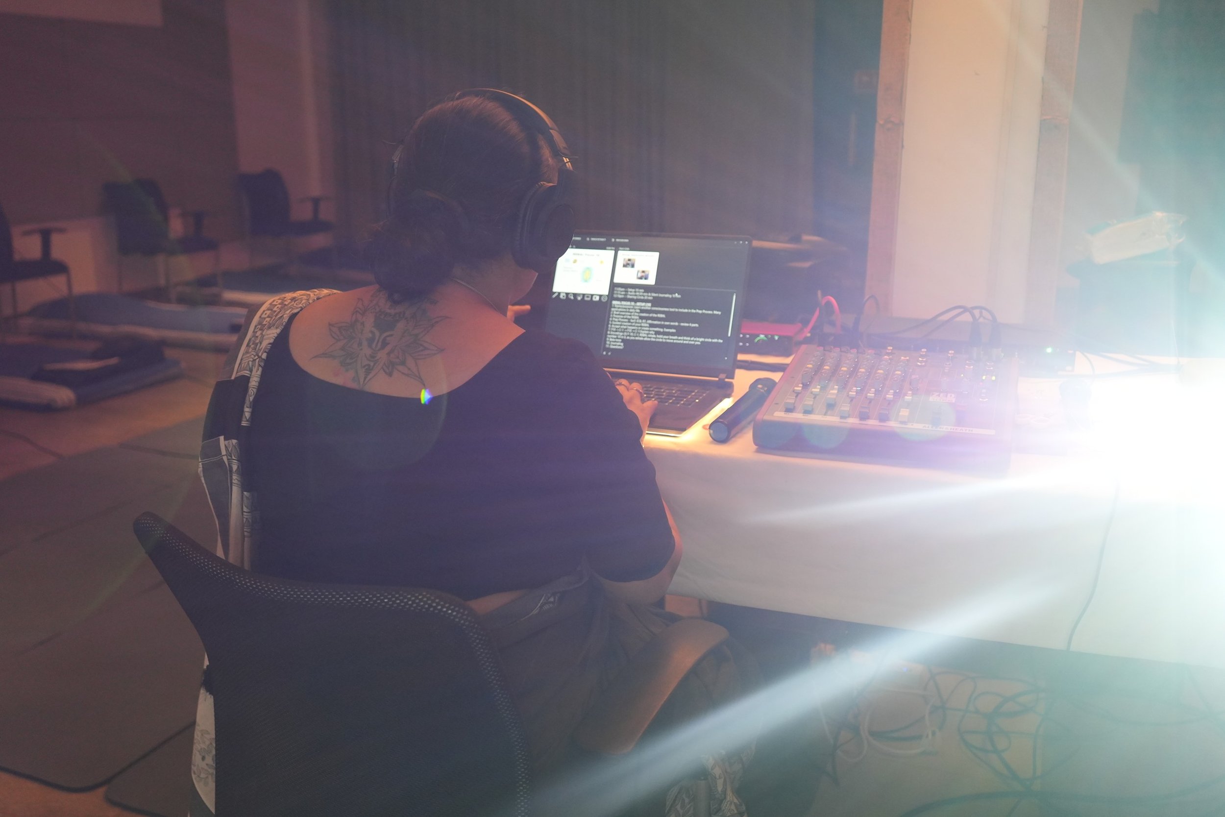 Dr Rashhi Sharma conducting an OBE workshop, playing OBE music via the audio setup