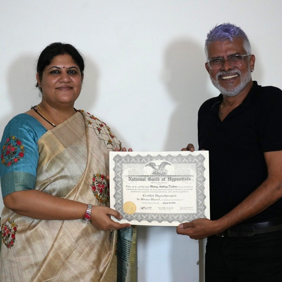 	
Melroy receiving the NGH hypnotherapy practitioner certificate from Dr Rashhi Sharma.