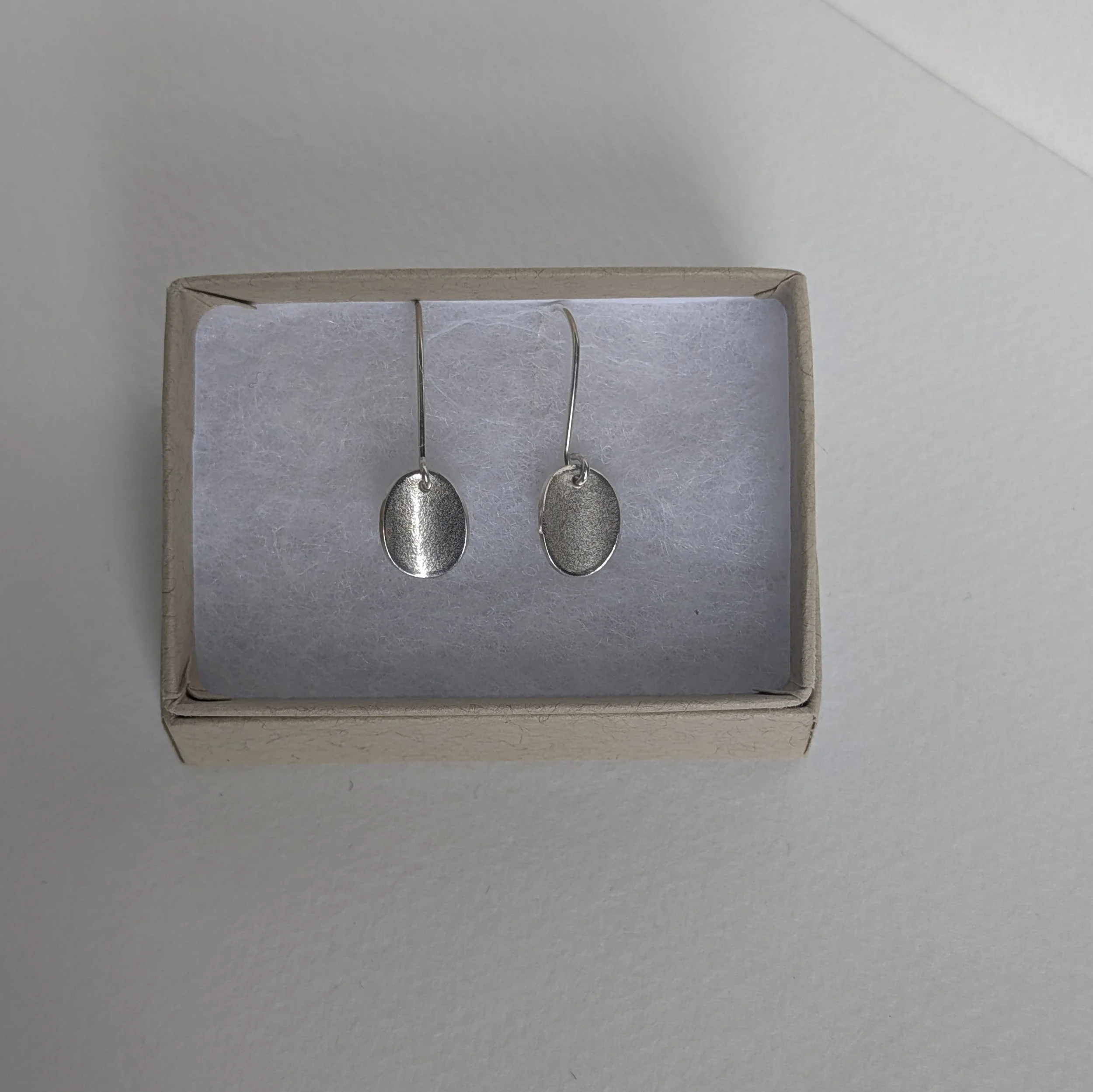 Wee oval drop earrings in box.jpg