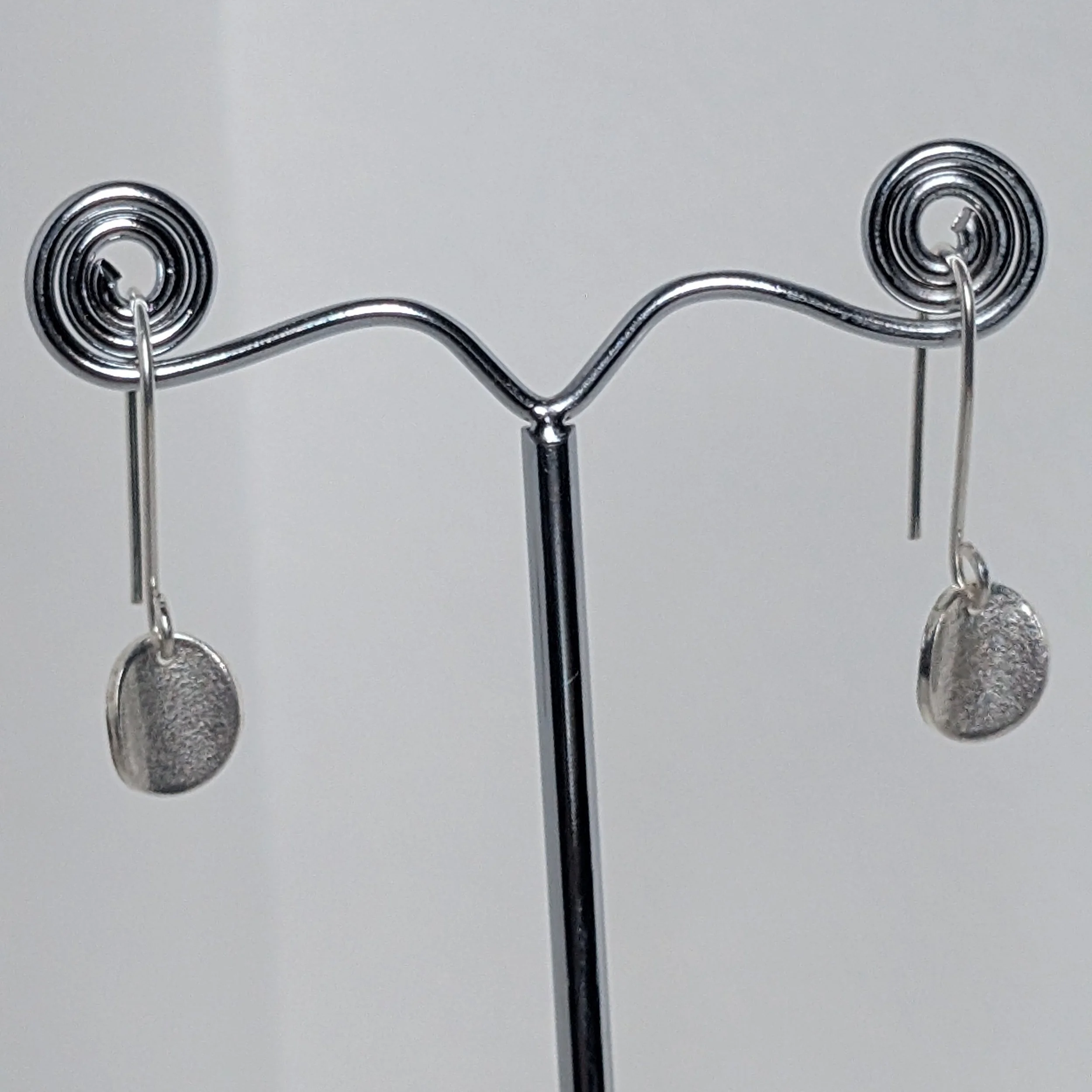 Wee oval drop earrings hanging.jpg