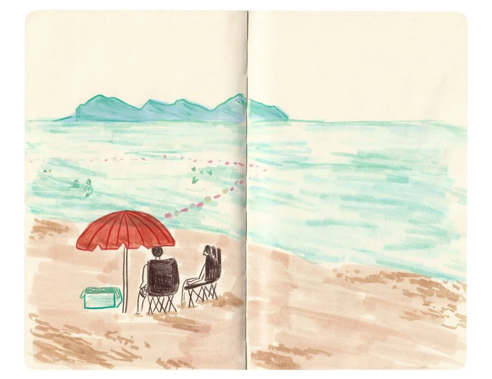 Mixed media drawing of two people sitting under an umbrella at the beach with mountains in the distance.