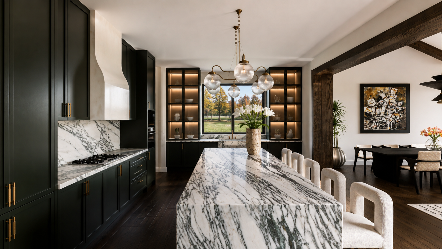 Luxury kitchen in Potomac, Maryland featuring green cabinetry, dramatic marble countertops, custom built-ins, plaster hood and sculptural lighting Floren Chandelier by CTO Lighting. Interior design by Tillotama Studio.