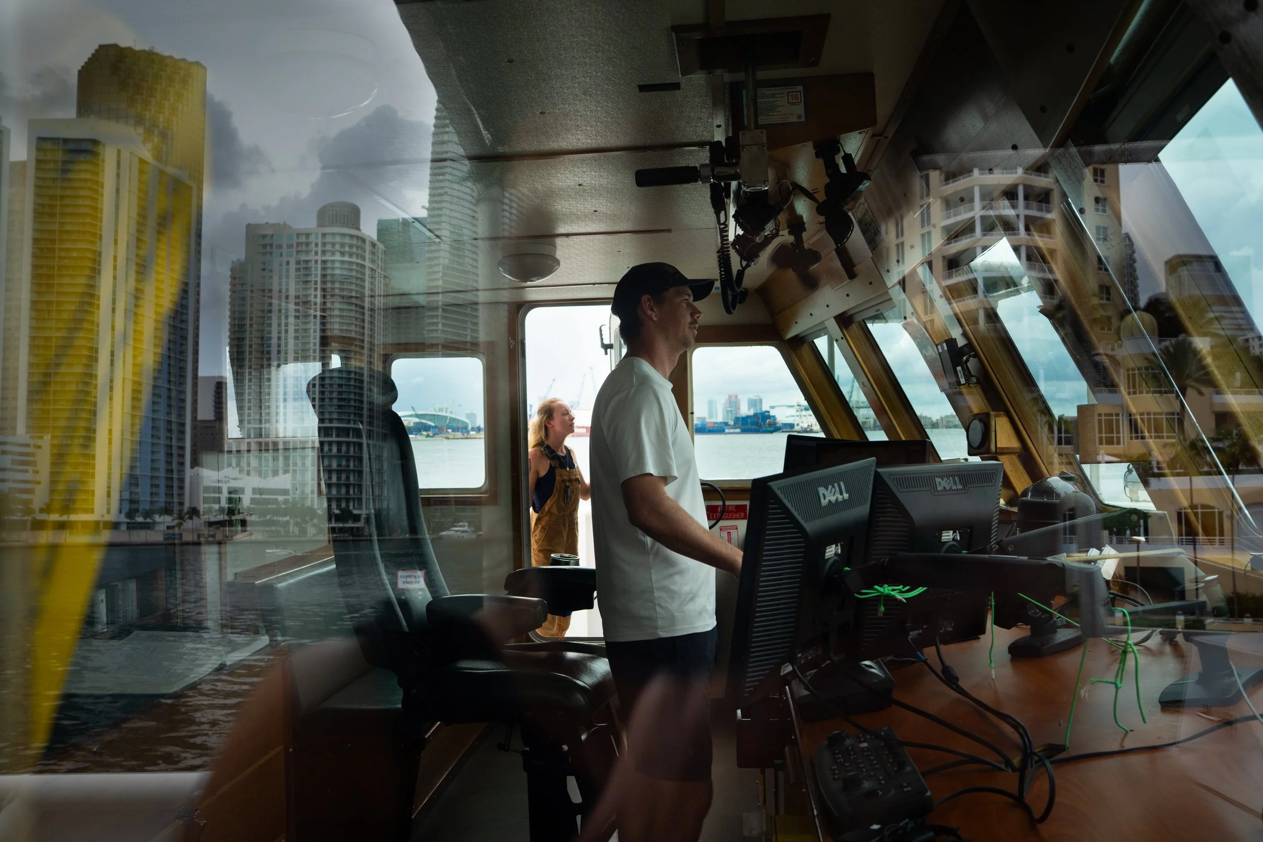 Captain John Cramer, 36, pilots the vessel back toward shore as assistant engineer Paige Fitzpatrick stands in the doorway on the morning of September 4, 2025.
