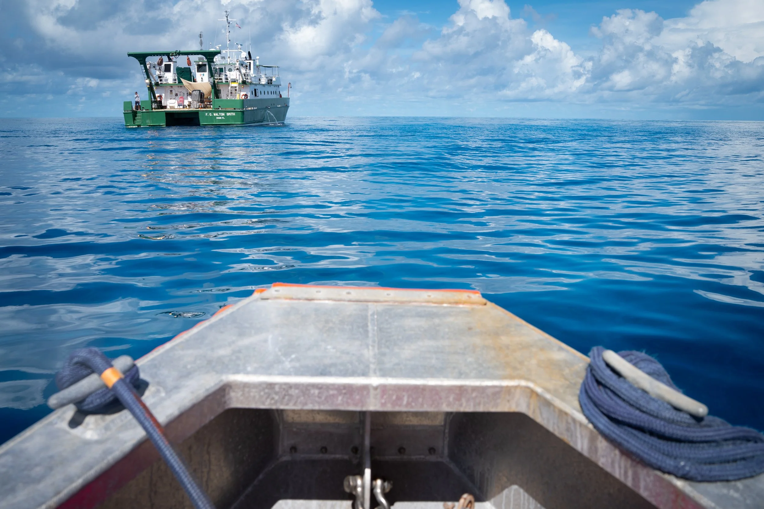 A team of divers returns to the ship after retrieving a scientific instrument from the seafloor that had been collecting data on the Florida Current.