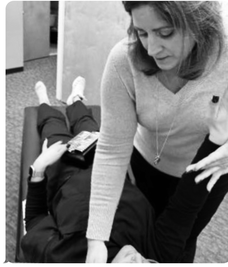 Rose Mastrantoni performing a hands on health assessment with a patient at Renew Well NY in Hauppauge NY