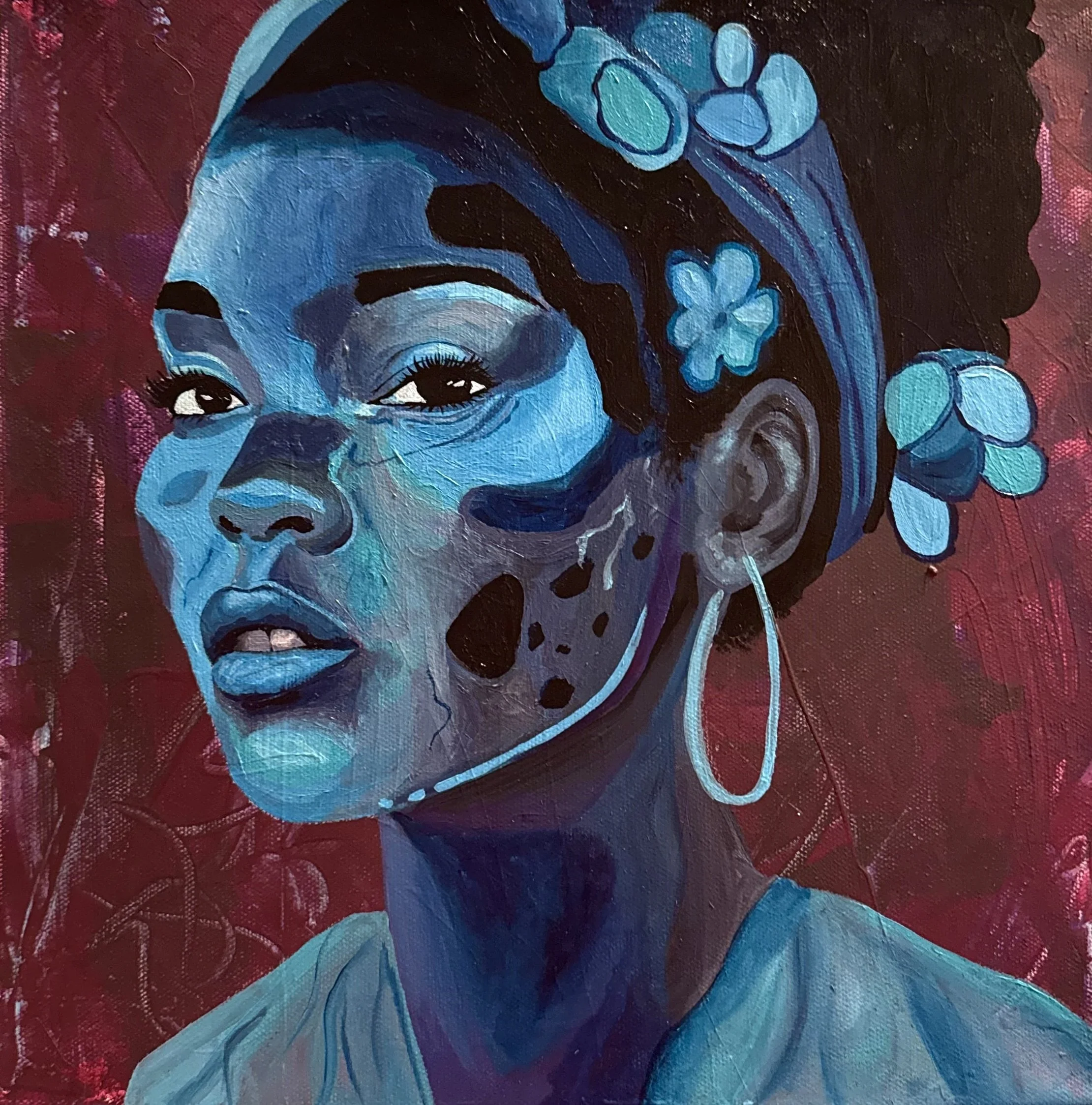 A stylized portrait of a woman with dark skin painted in various shades of blue, with flowers in her hair and a large hoop earring, depicting a contemporary art style.