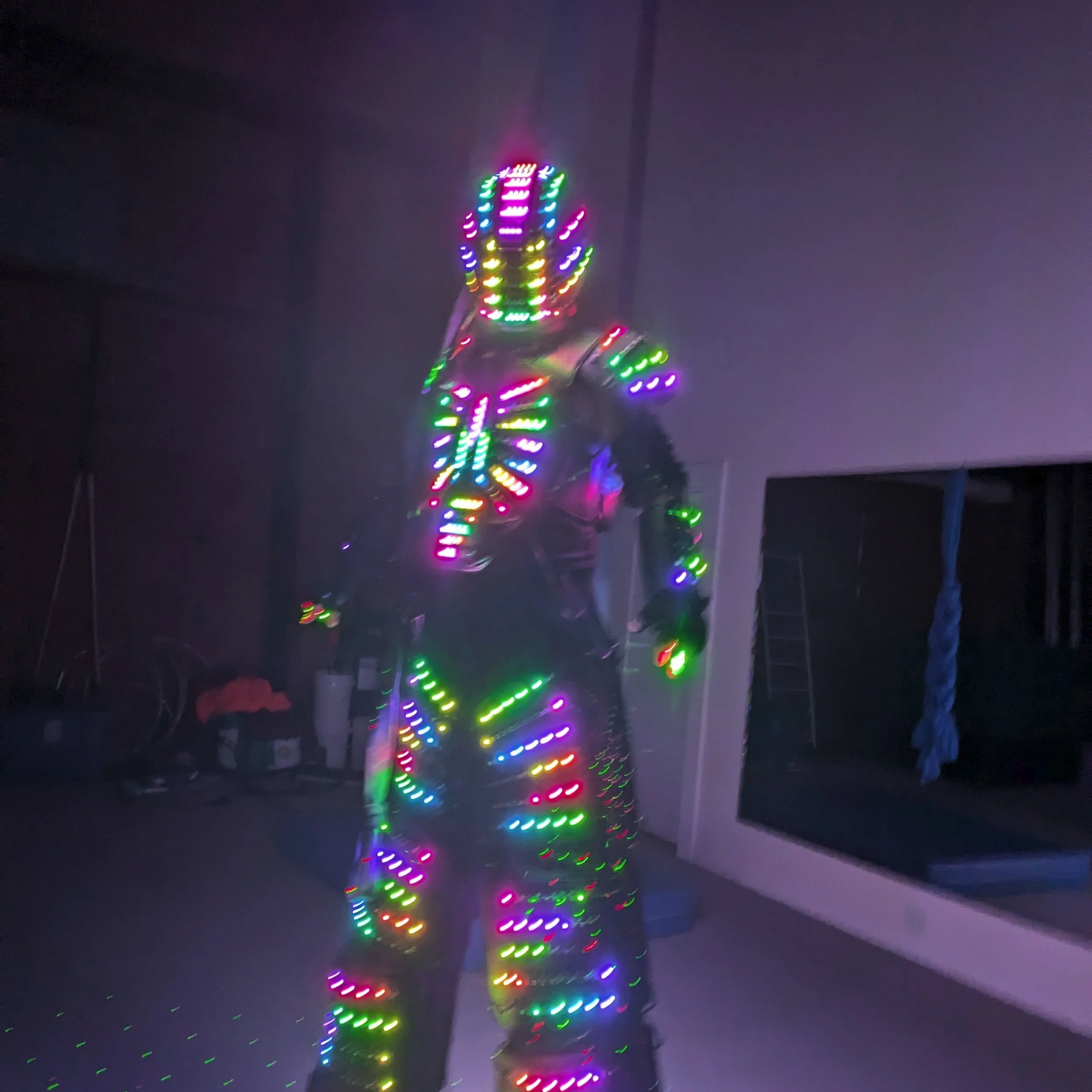 A person in a LED robot costume