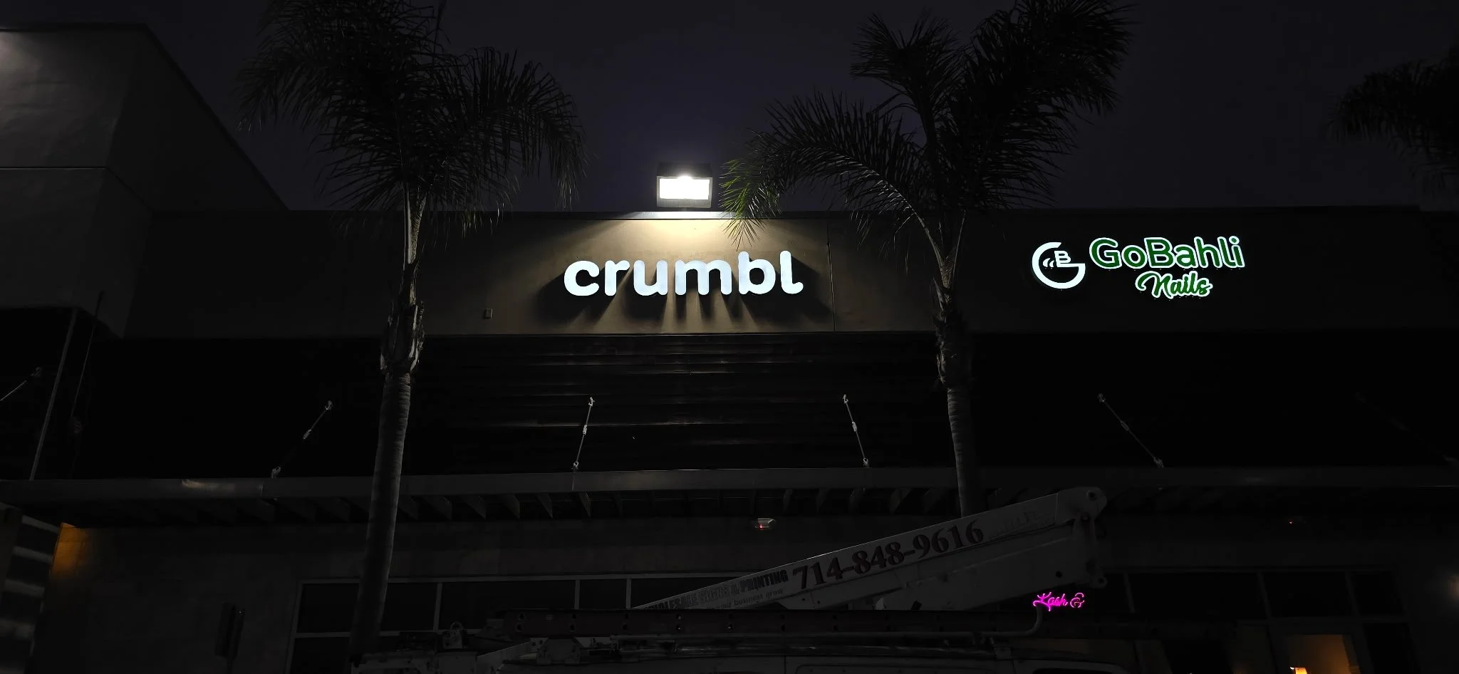 Channel letter wall sign at a retail space night illuminated near Los Angeles, Ca.