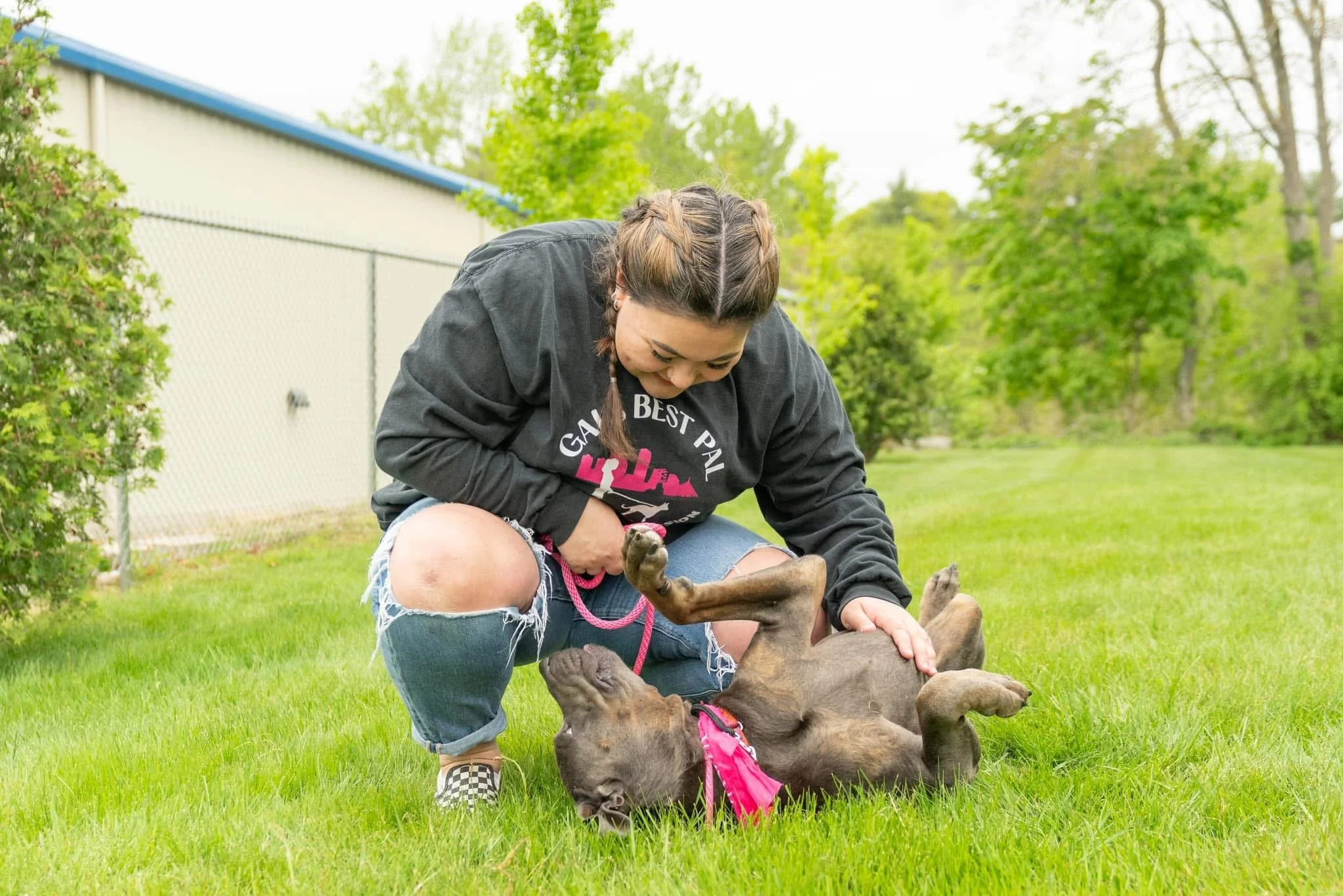 Gals Best Pal volunteer playing with an adoptable dog