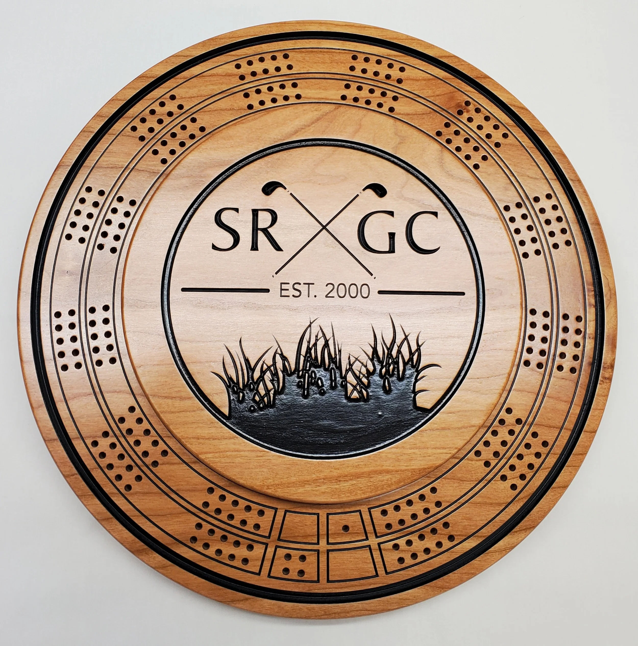 Custom CNC engraved cribbage board with logo.