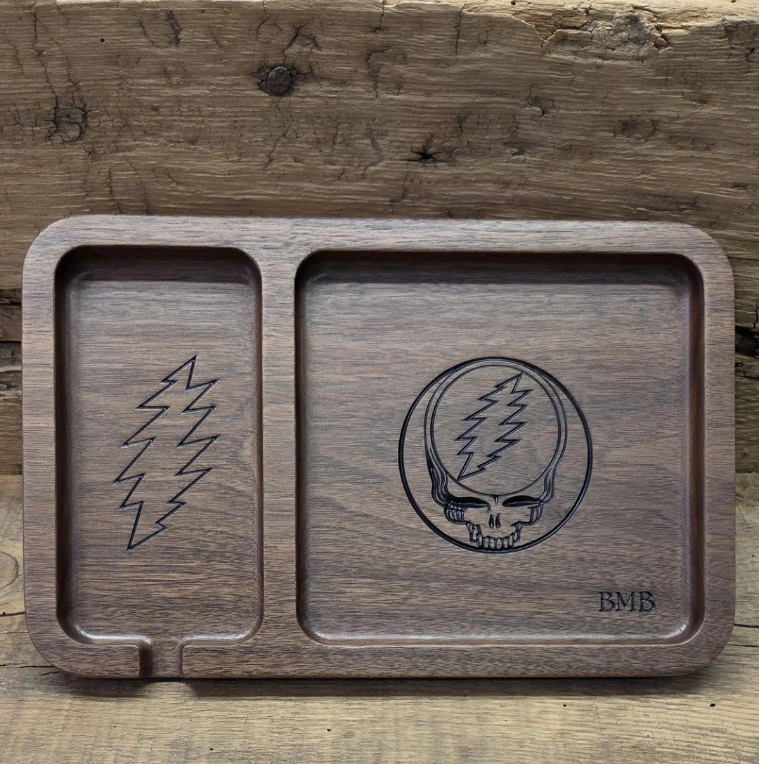 This custom valet tray is made from walnut wood and is CNC engraved and painted, then finshed until nice and smooth.  Message me if you're looking for your own custom tray. 