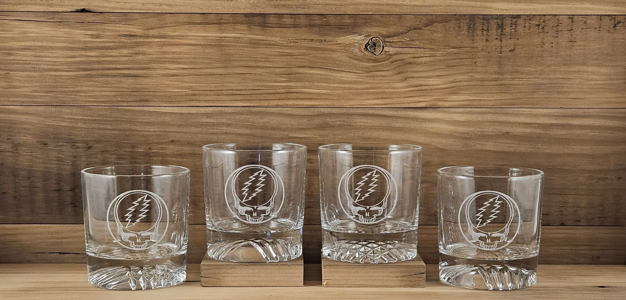 Four Rocks glasses laser engraved with Grateful Dead's Steal your Face design.