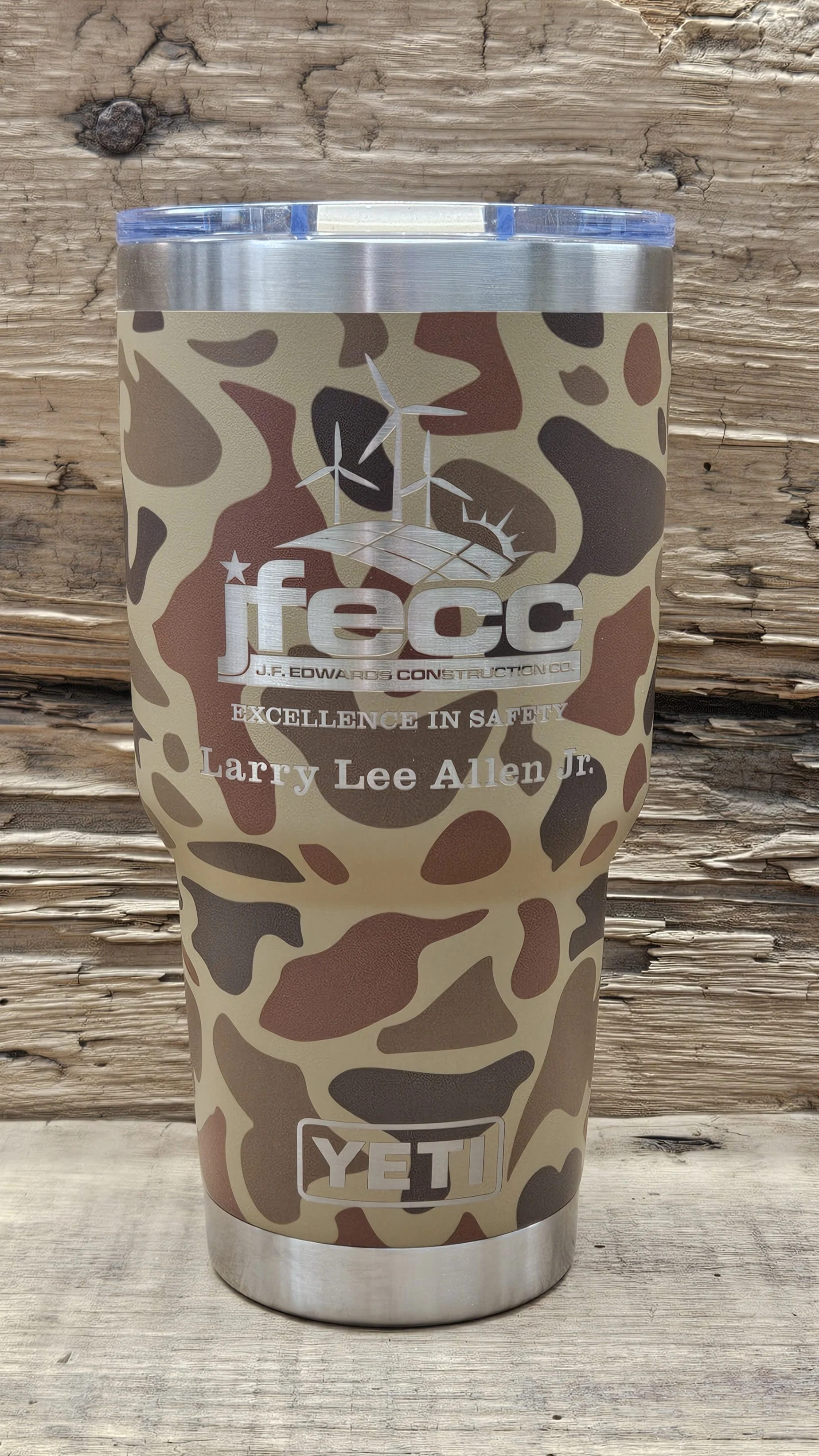 A camouflage YETI tumbler laser engraved with logo and text for J.F. Edwards Construction Co., and the name Larry Lee Allen Jr.