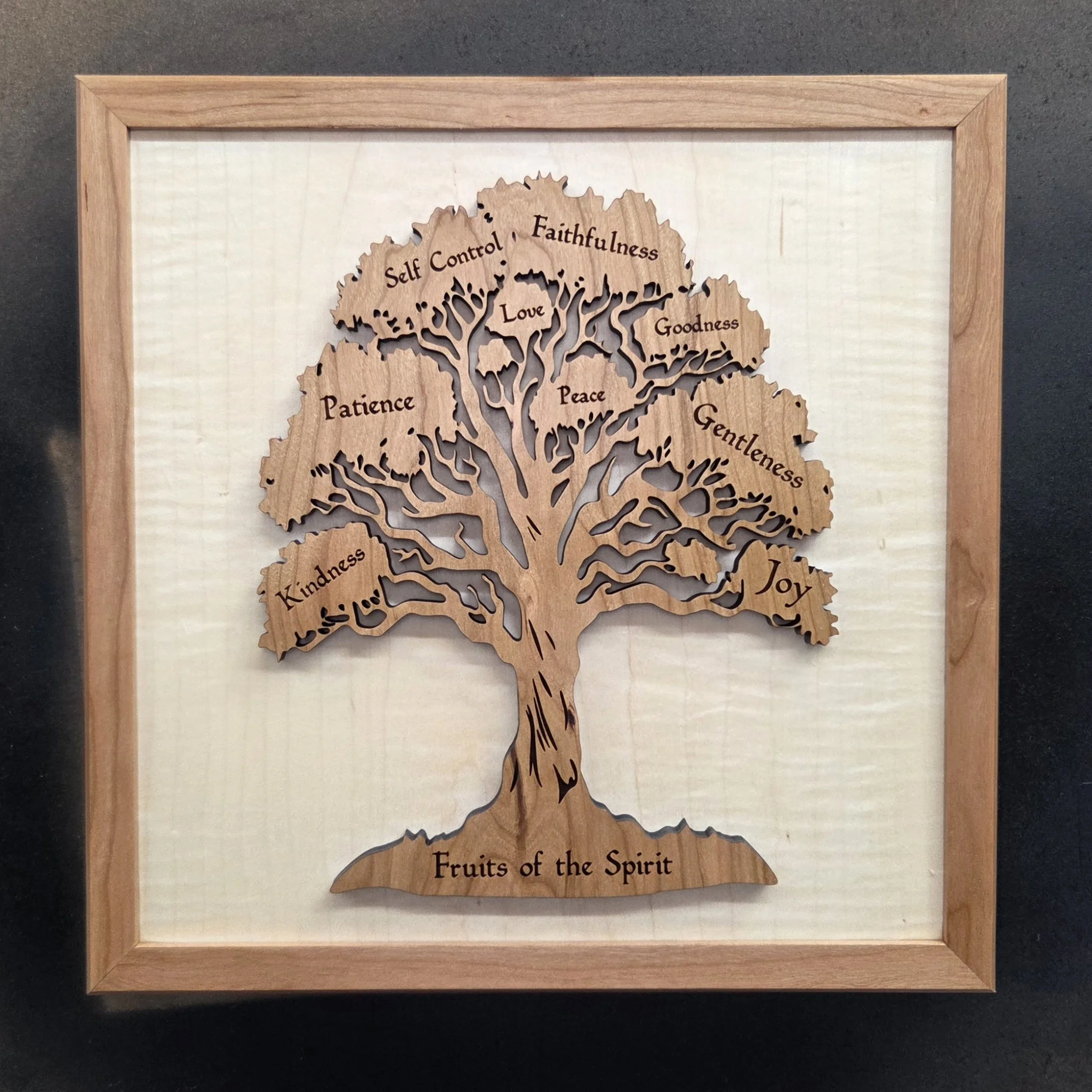 Made two of these custom "Fruits of the Spirit" wall plaques for a local customer.  Fun project and I like the striped maple wood I used for the background, it contrasts nicely with the cherry wood treed and frame..