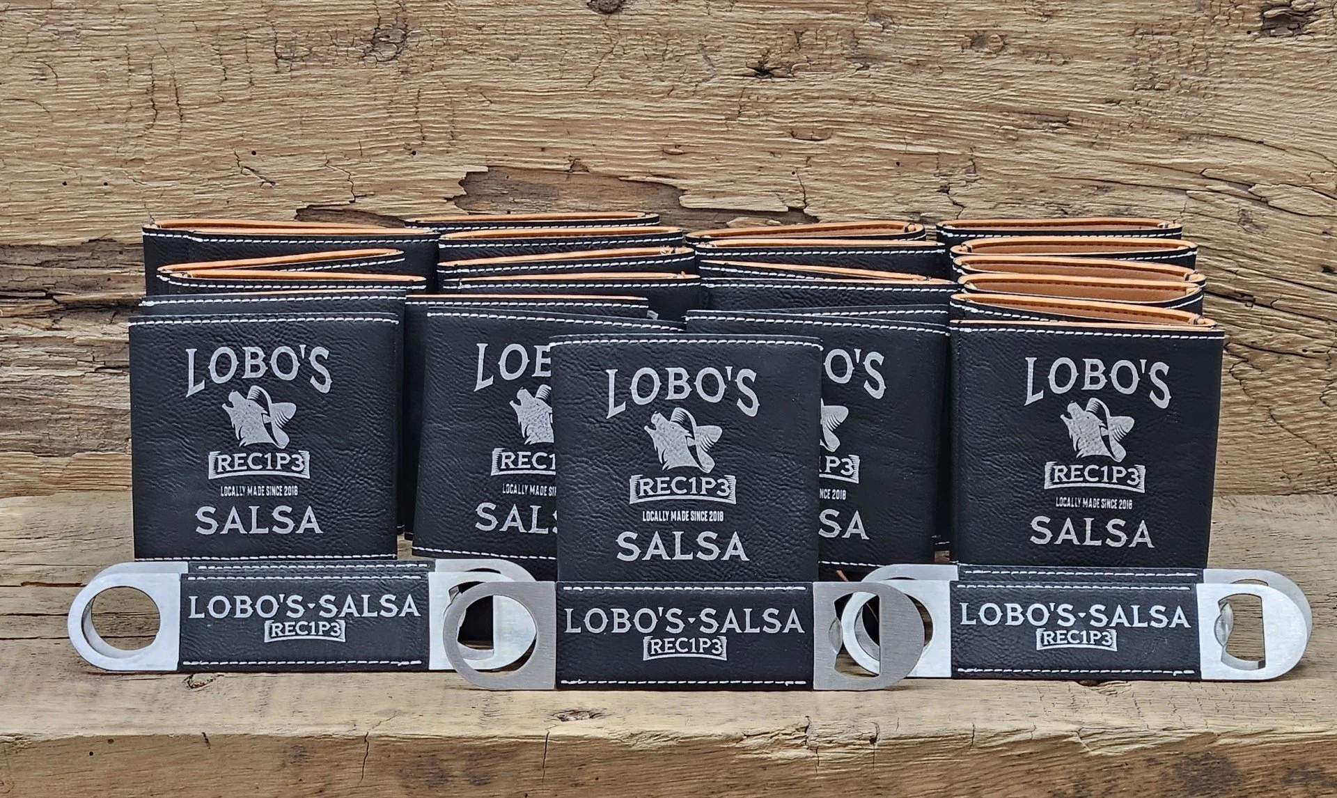 Leatherette can coolers/koozies and bottle openers laser engraved with customer logo