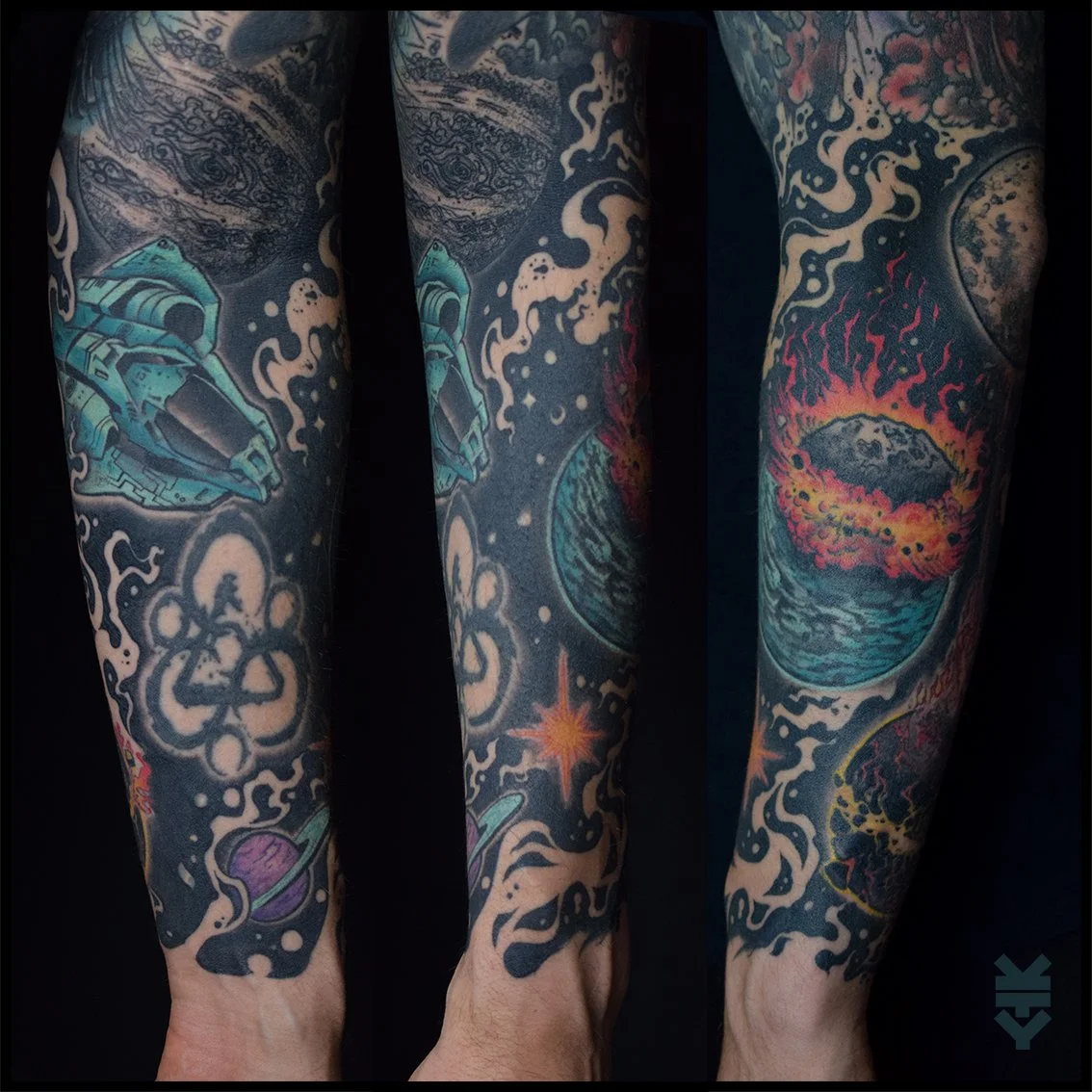 Colorful space-themed tattoos on a person's arm, featuring a spaceship, planets, a star, and a cosmic scene with an asteroid impact.
