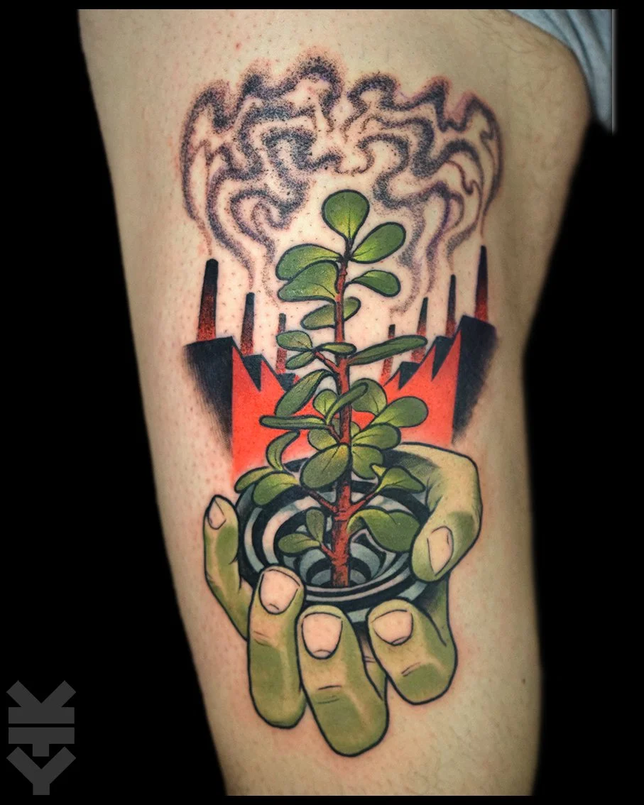 Tattoo of a green plant with rounded leaves in a small black pot, held by a greenish hand, with stylized flames and gray smoke above.