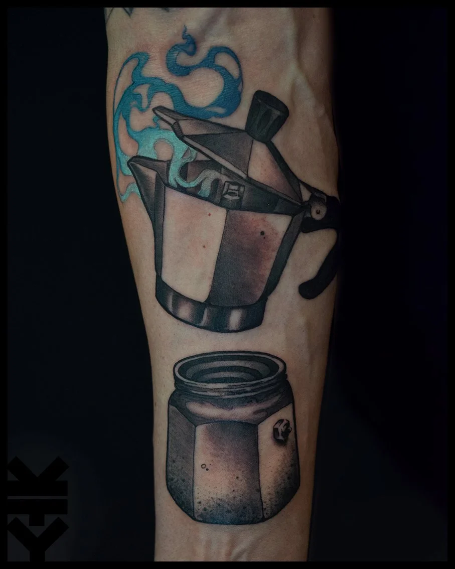 Tattoo of a moka pot pouring coffee into a jar on a person's arm.