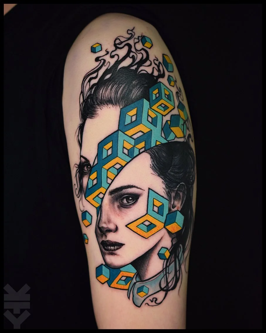 A realistic black and gray portrait of a woman with geometric 3D cube designs in bright colors overlapping her face on a tattoo.