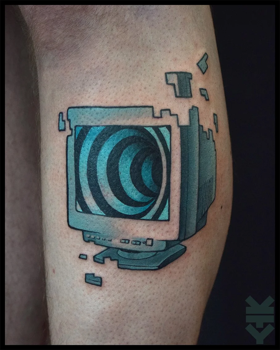 Tattoo of a broken piece of technology resembling an old computer monitor with a swirling pattern on its screen