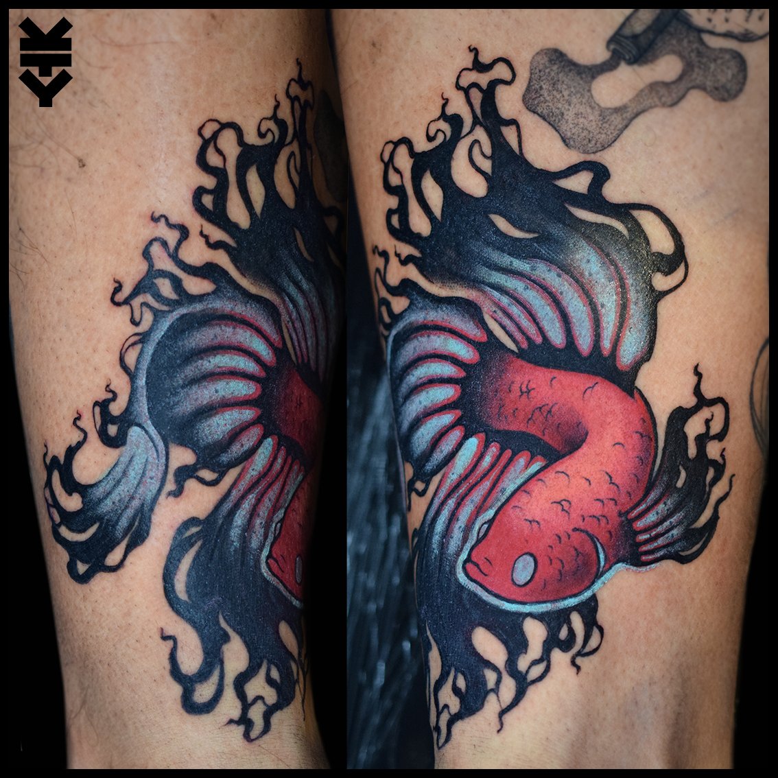 Tattoo of a red fish with black and white accents, surrounded by black swirling flames or smoke.