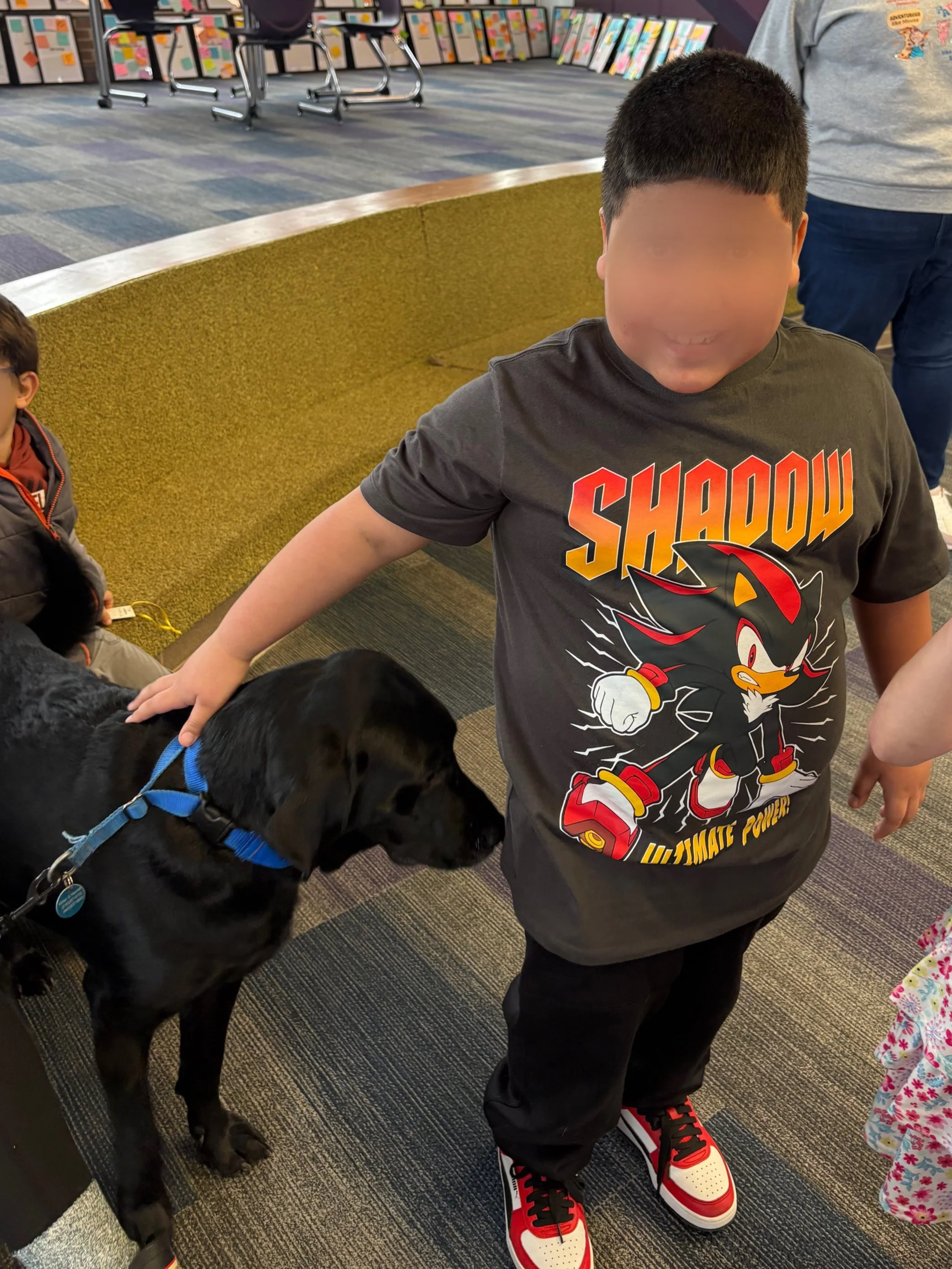 Let's "Paws" and Read Together - Annual interactive family reading night as 'One Book, One School' celebration kicks off in honor of a beloved teacher who shares her love of reading and dogs with the school.