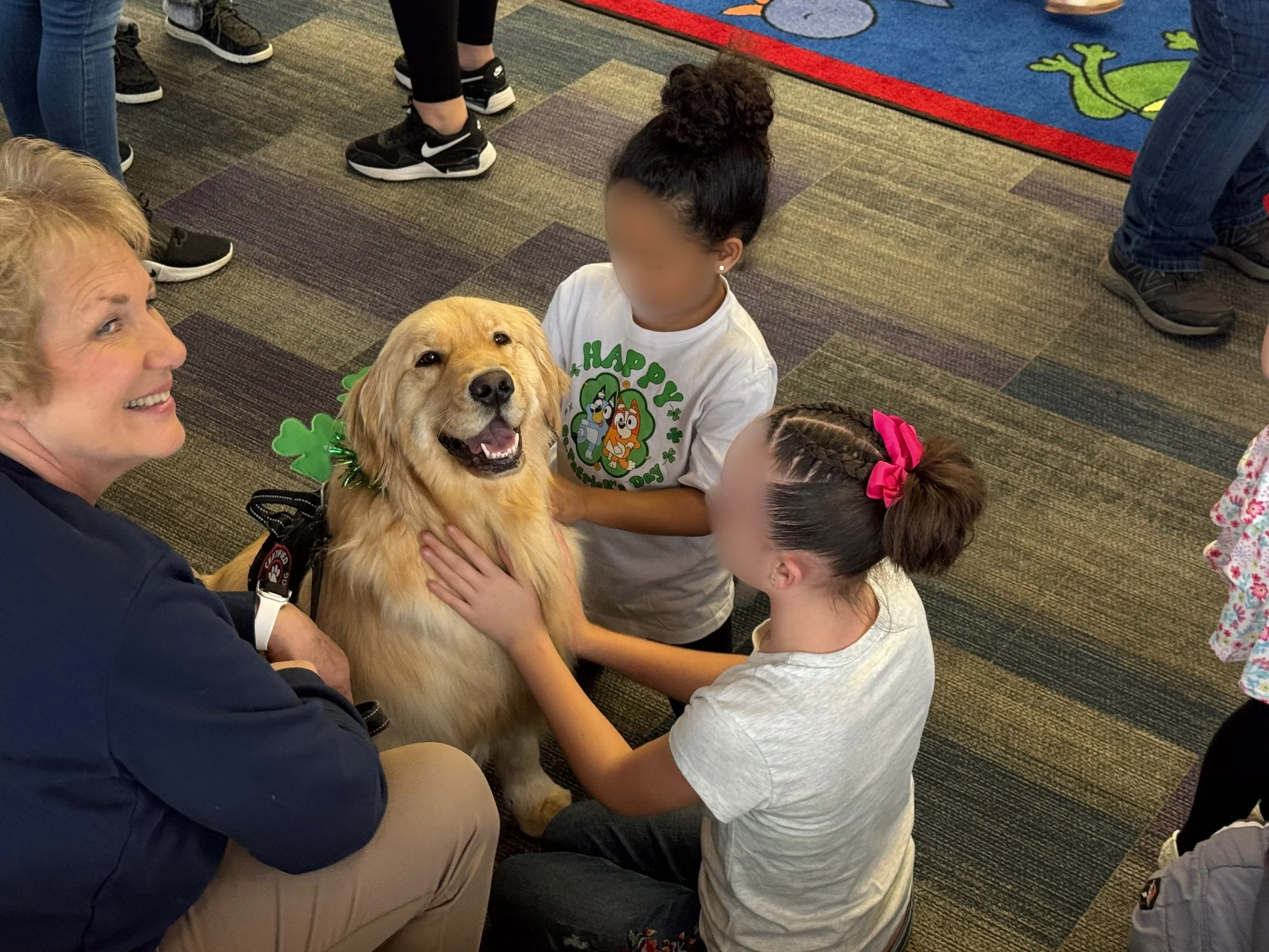 Let's "Paws" and Read Together - Annual interactive family reading night as 'One Book, One School' celebration kicks off in honor of a beloved teacher who shares her love of reading and dogs with the school.