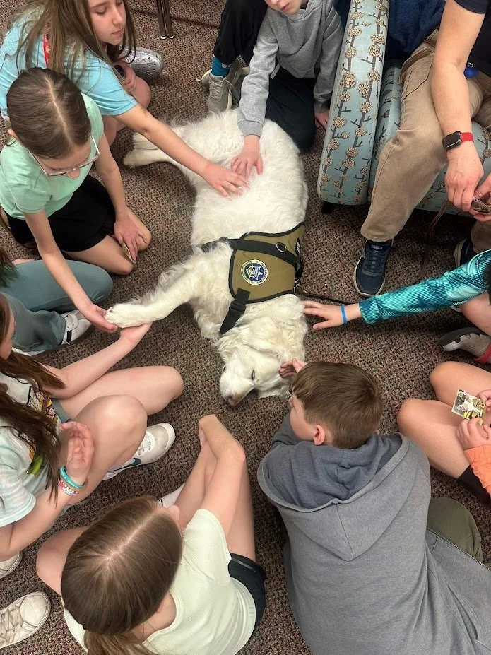 Our CCC team loved connecting with the students at Independence Middle School for Mental Health Day! They offered some much-needed furry stress relief while explaining the 'paws-on' work our dogs do to support mental health every day.
